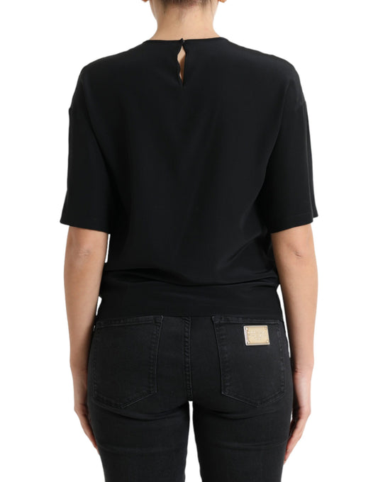 Black top with scoop neckline and back cutout