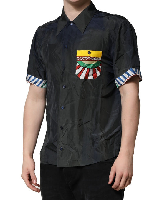 Man wearing black shirt with colorful emblem on left chest