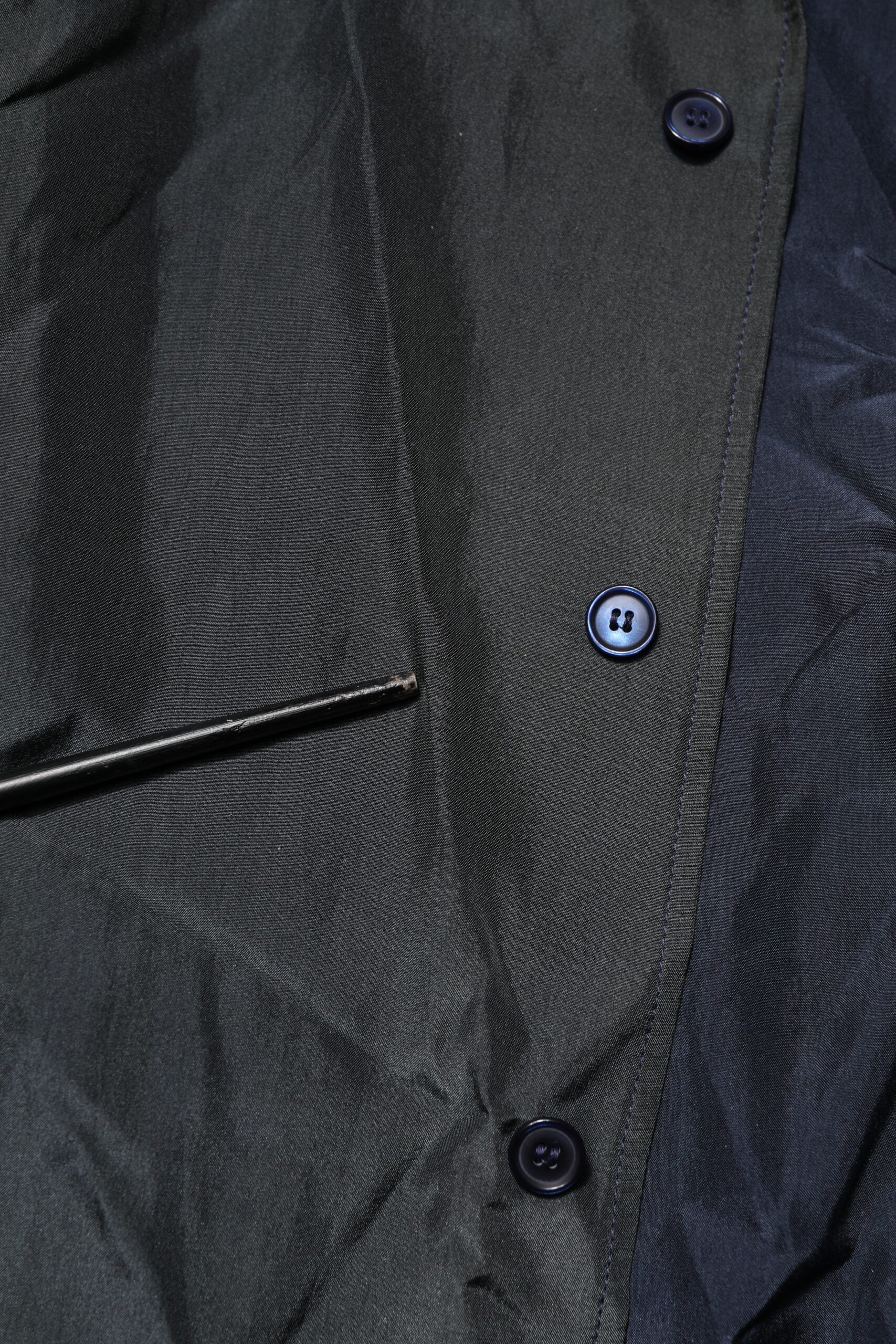 Black jacket with buttons on front