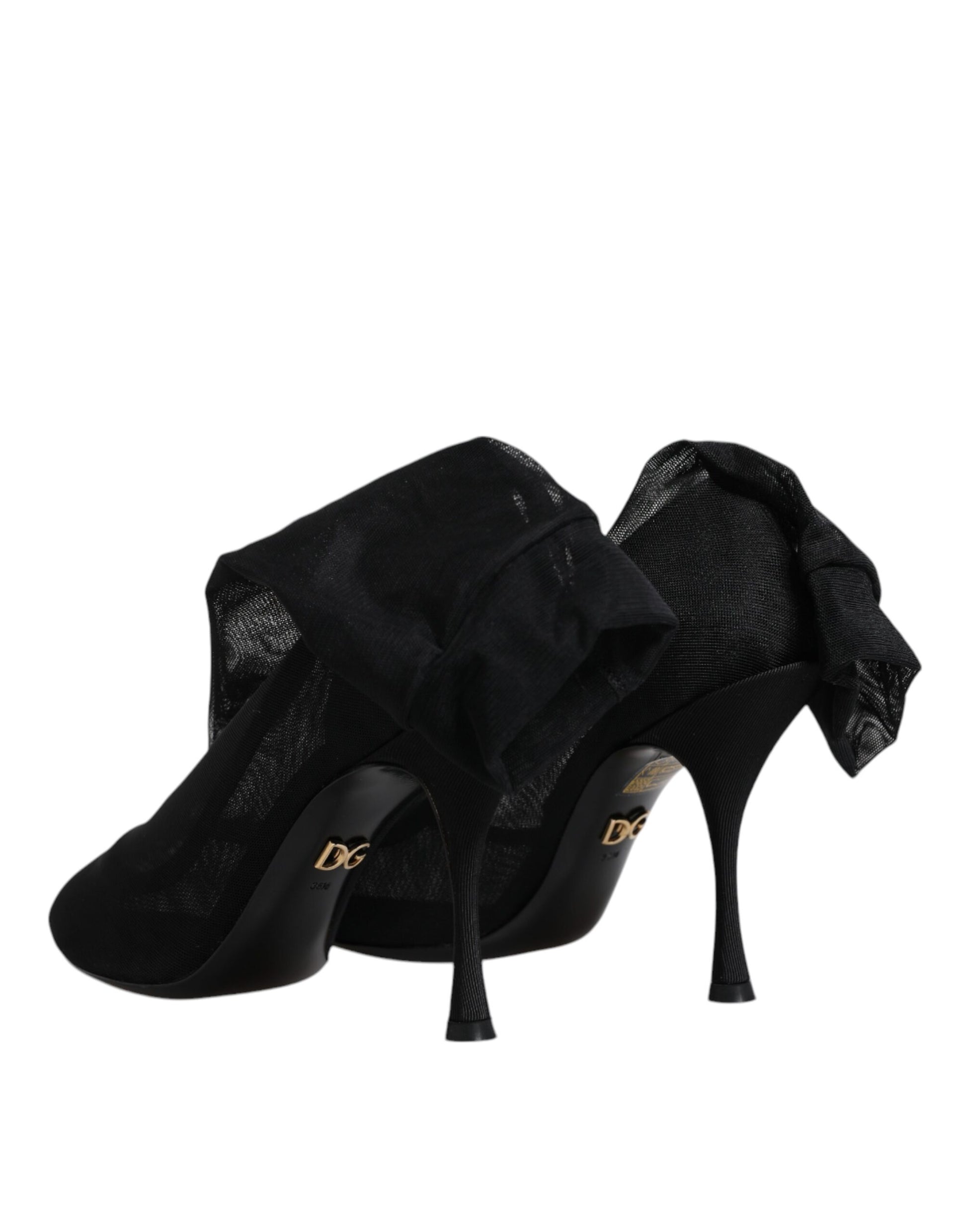 Pair of black high heel shoes with lace detailing