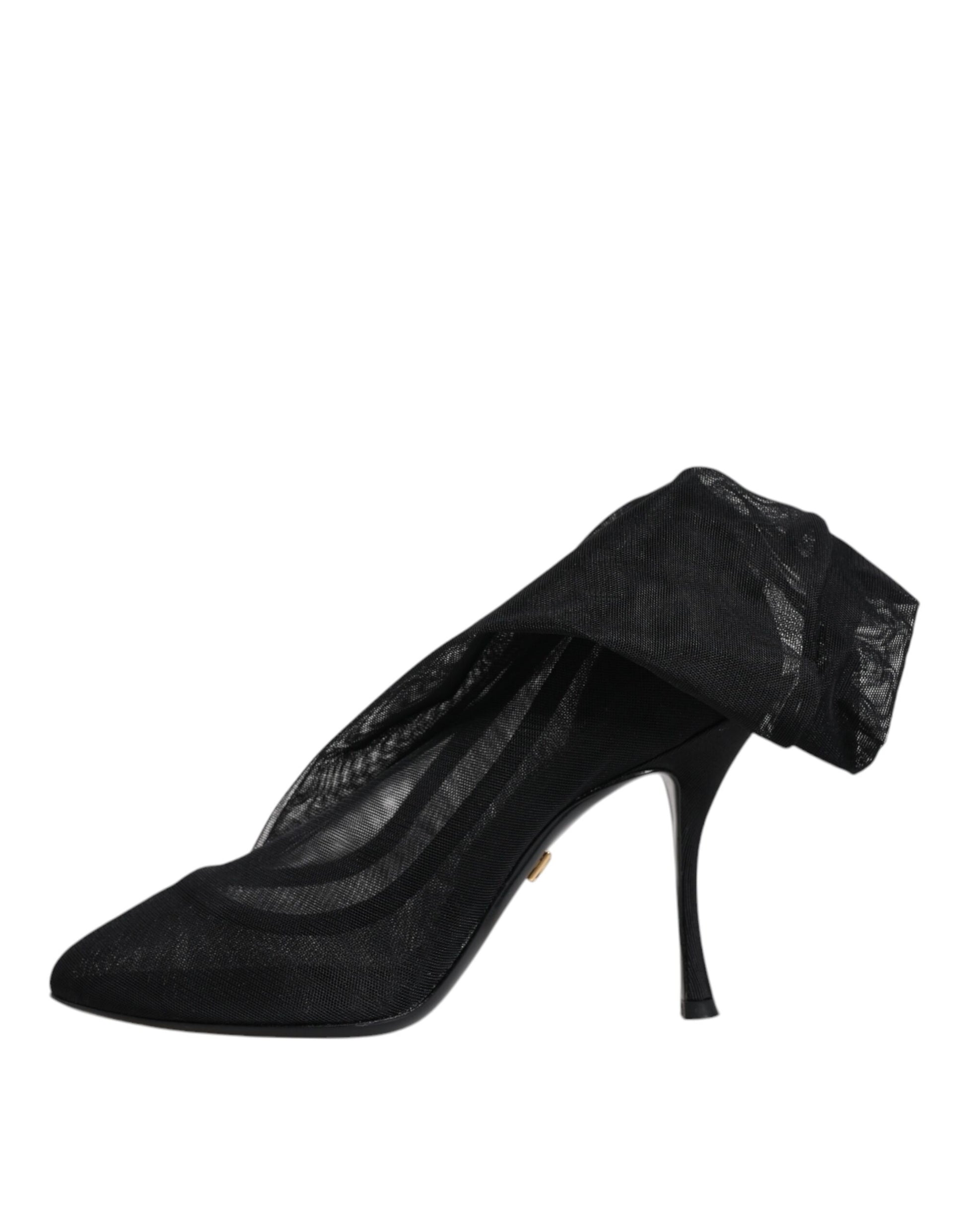 Black high heel shoe with ruffled detailing on toe