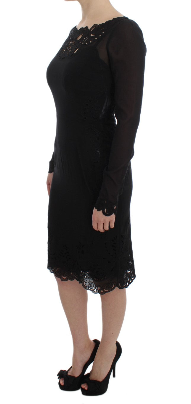 A black silk stretch sheath dress with lace detailing on the bodice and sleeves