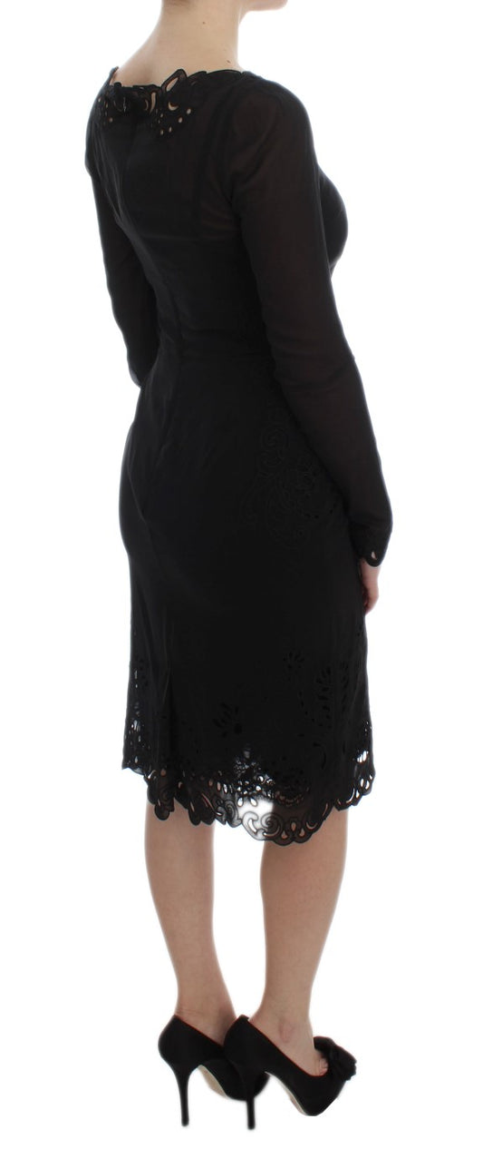 A black silk stretch sheath dress with lace detailing on sleeves and hem
