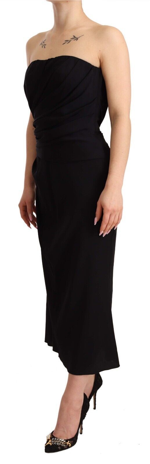 A black strapless sheath dress with a fitted silhouette and stretchy fabric