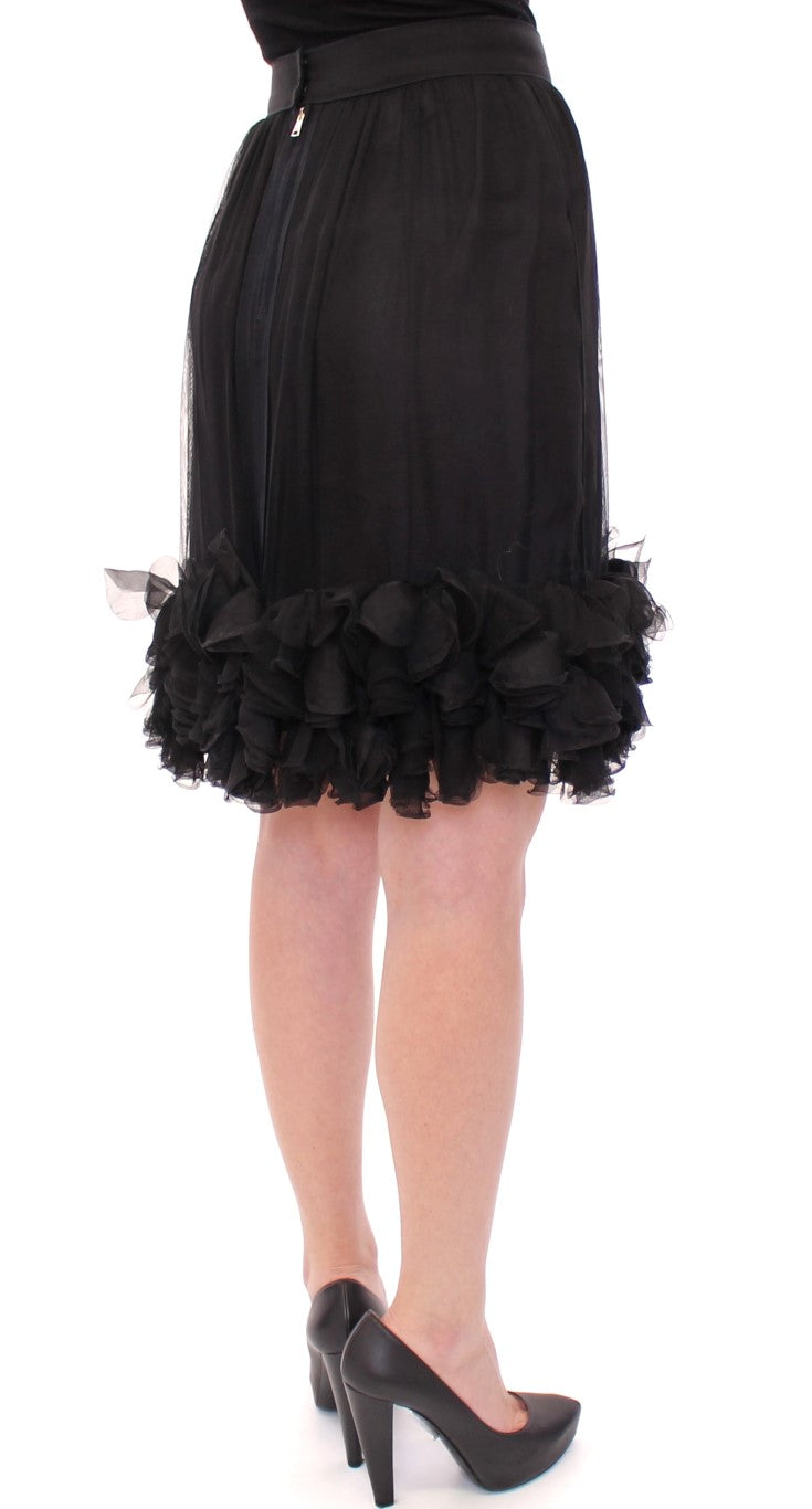 Black dress with ruffled hem and sleeves
