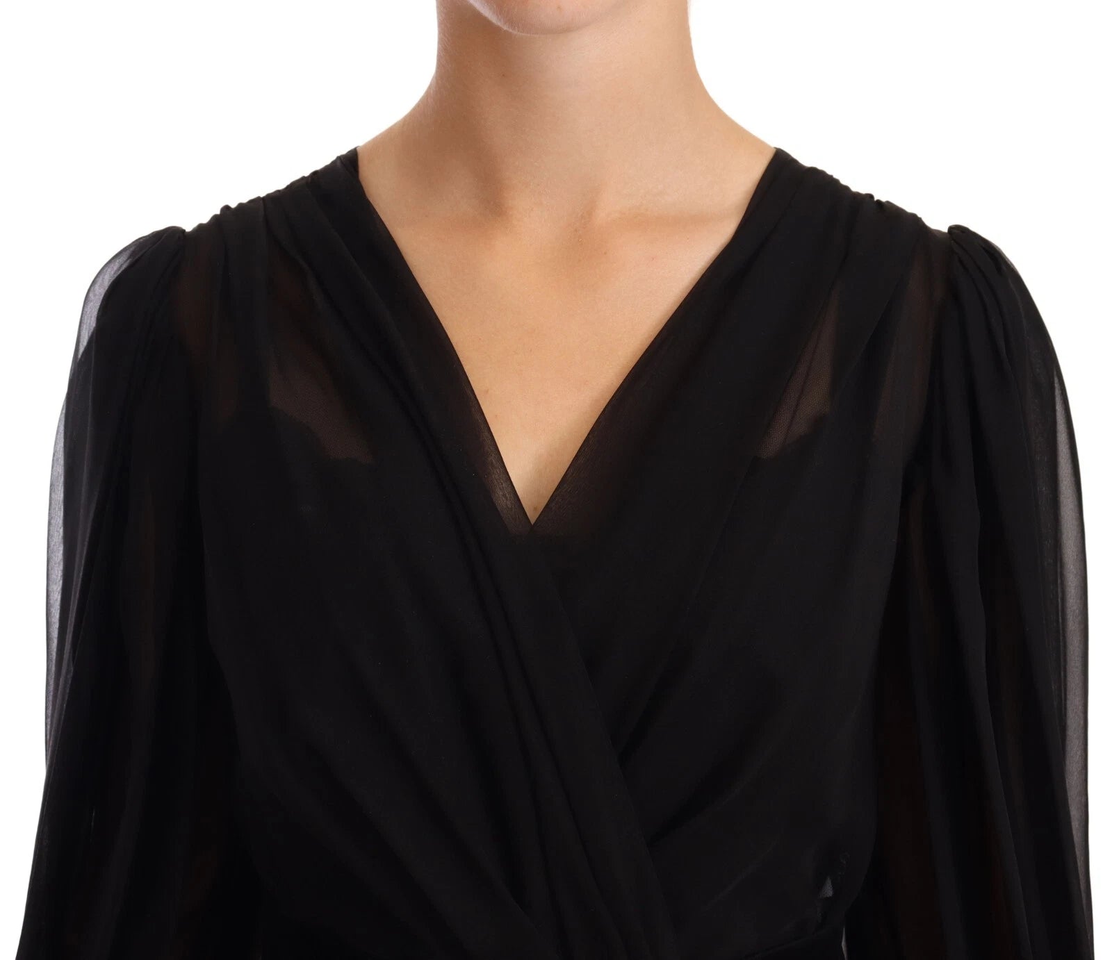 A black silk tulle long sleeve dress with a V-neck