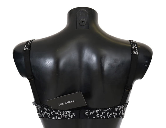 Black mannequin torso wearing a black and white bra