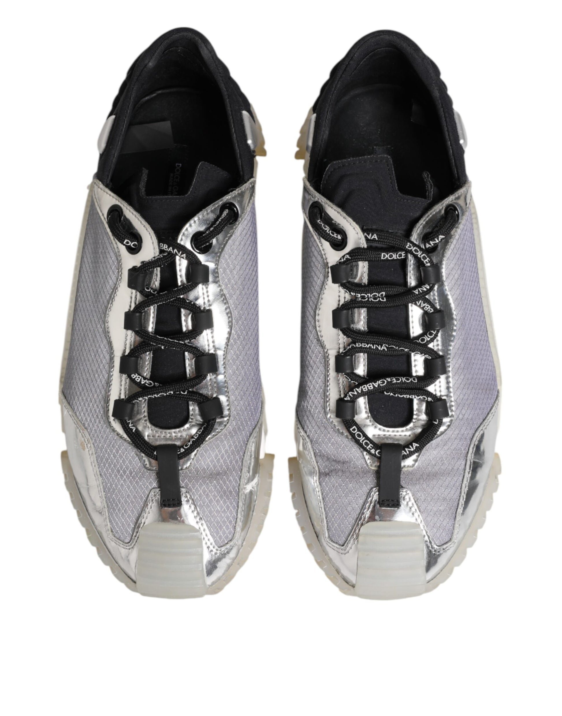 Pair of black and silver men's sneakers with laces, featuring a low top design