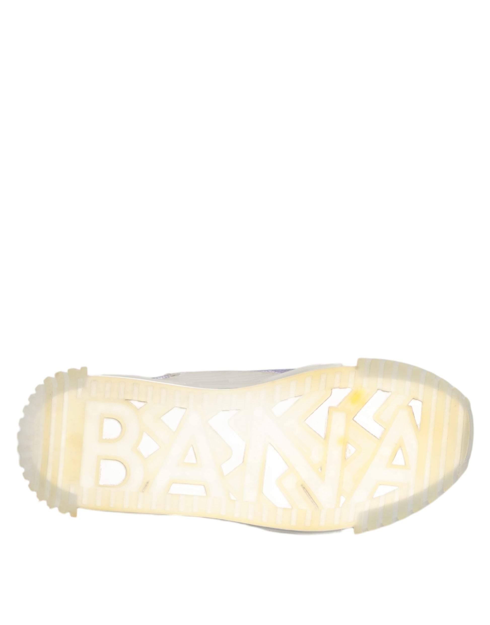A black and silver shoe with a low top, featuring the brand name "Dolce & Gabbana" on the side