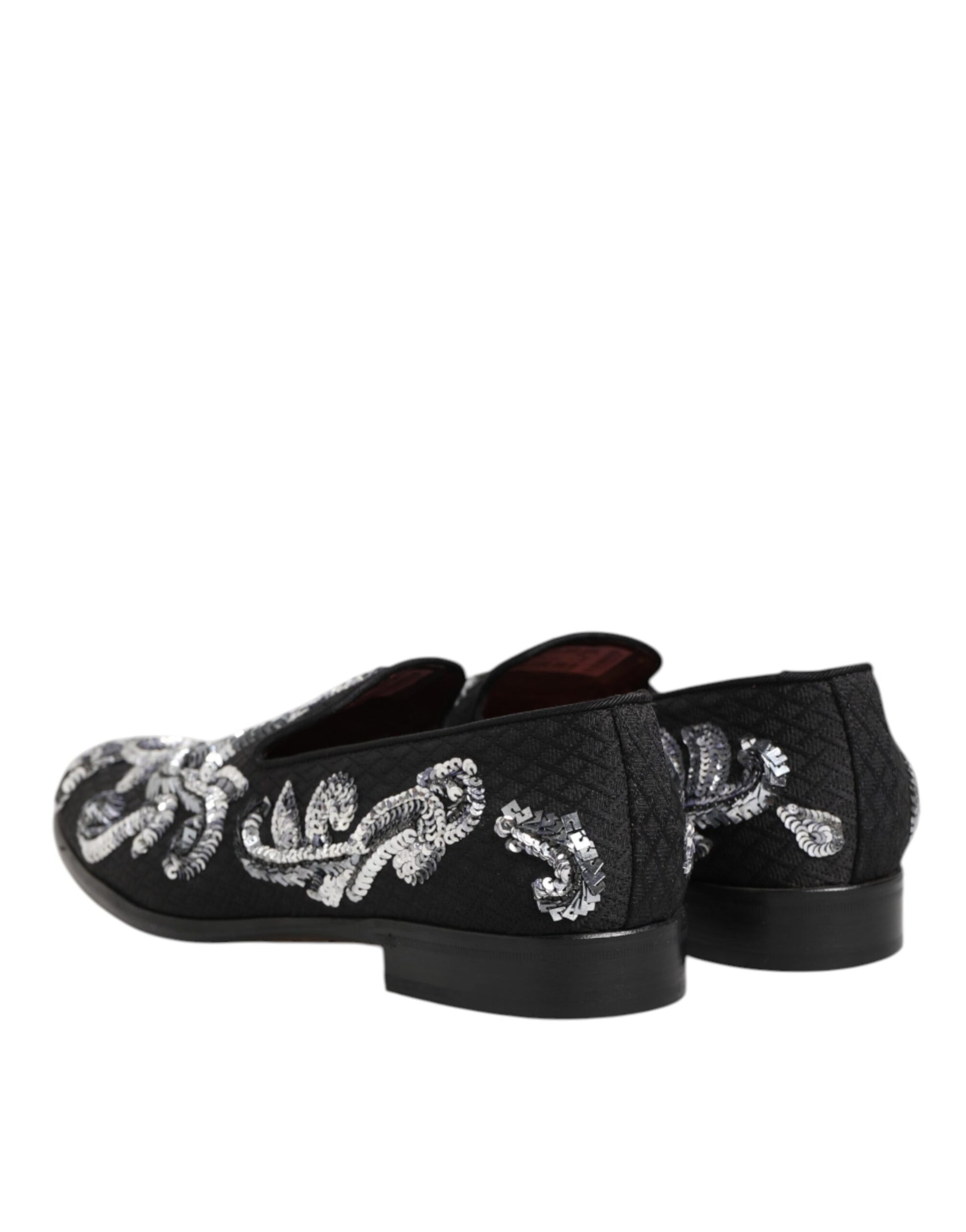 A pair of black sequin loafers with silver embroidery, designed by Dolce & Gabbana