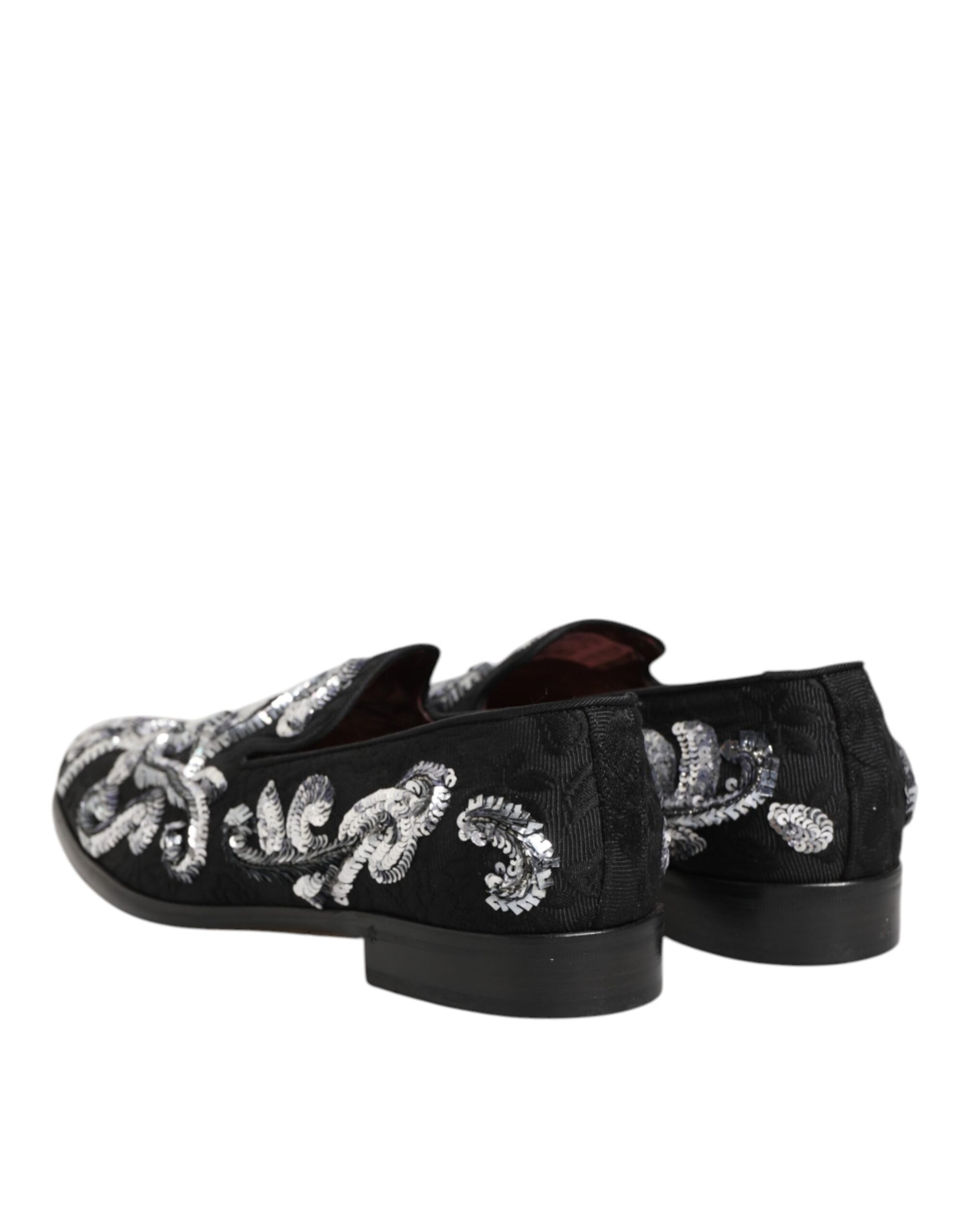 A pair of black sequined loafers with silver embroidery, designed for men