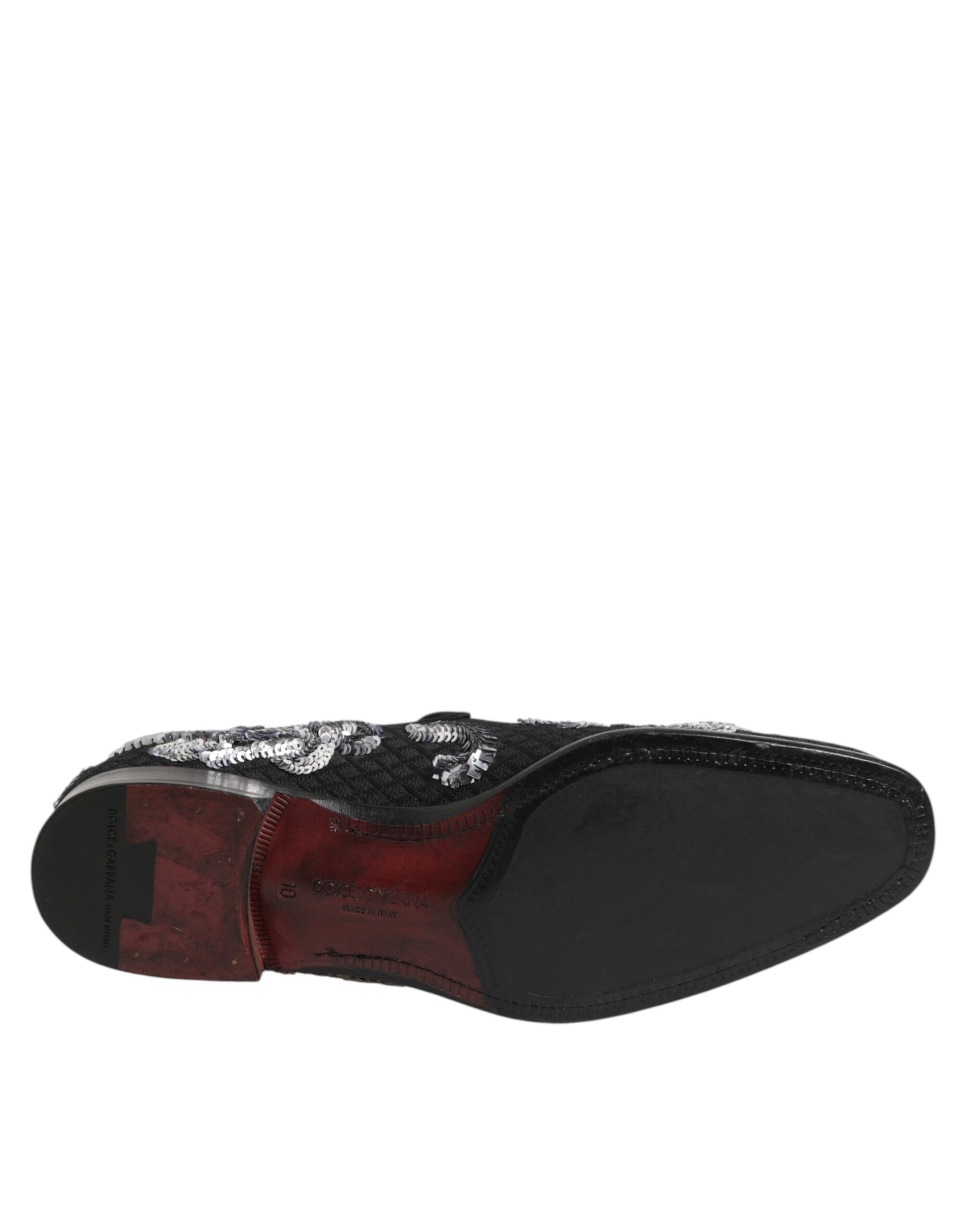 A pair of black sequin loafers with silver accents, designed for men's dress shoes
