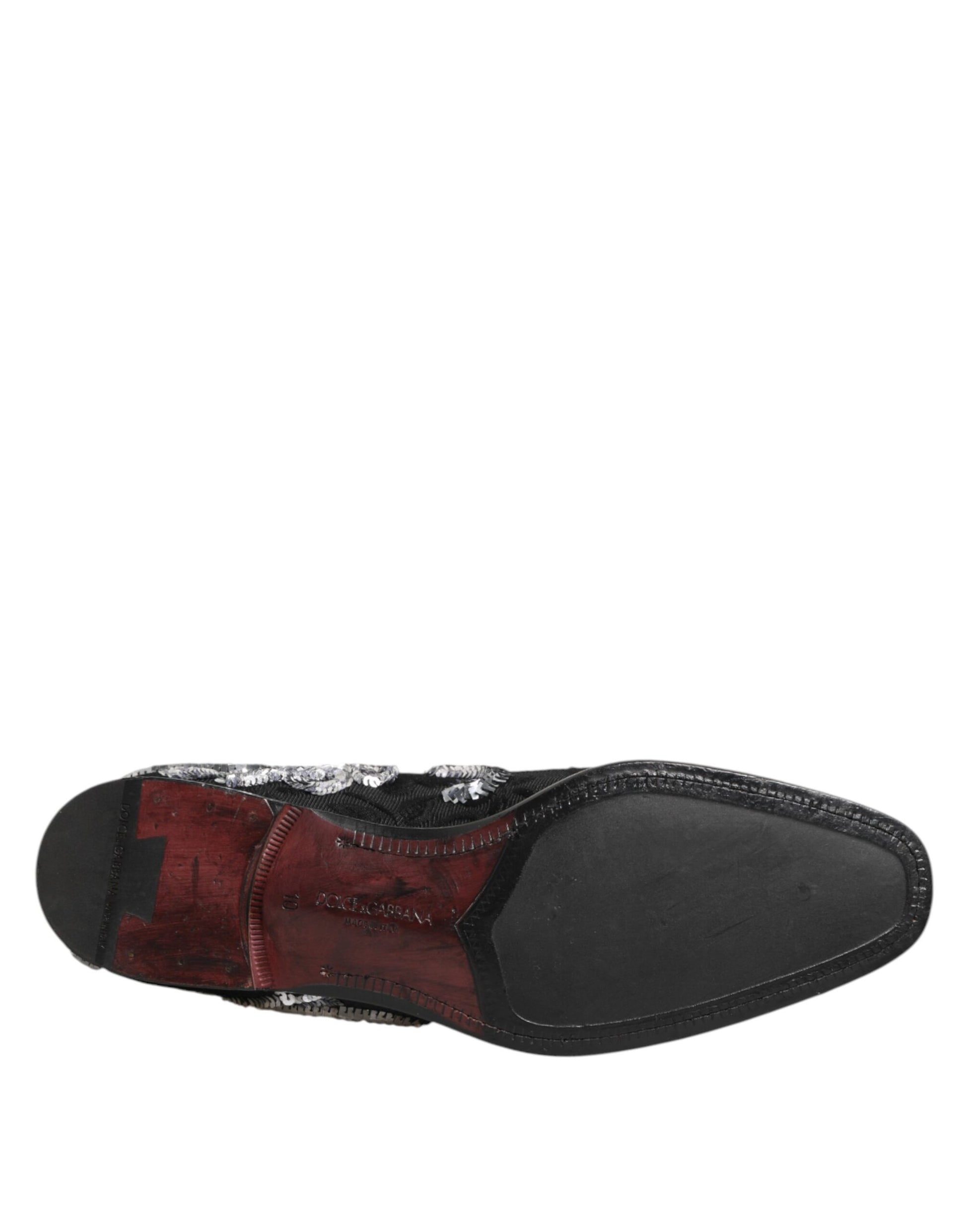 A pair of black sequined loafers with silver accents, designed for men's dress shoes