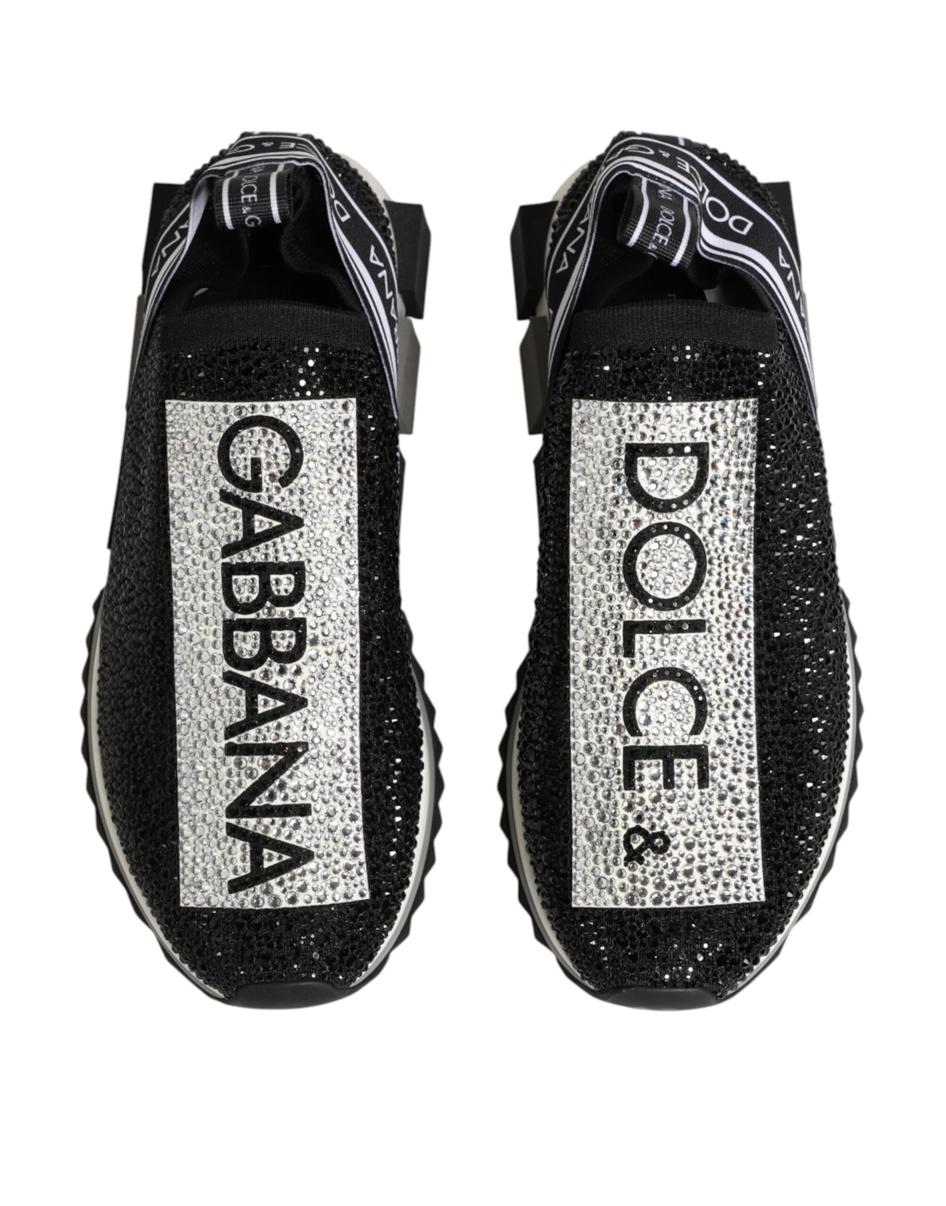 Pair of glittery shoes with brand names on side