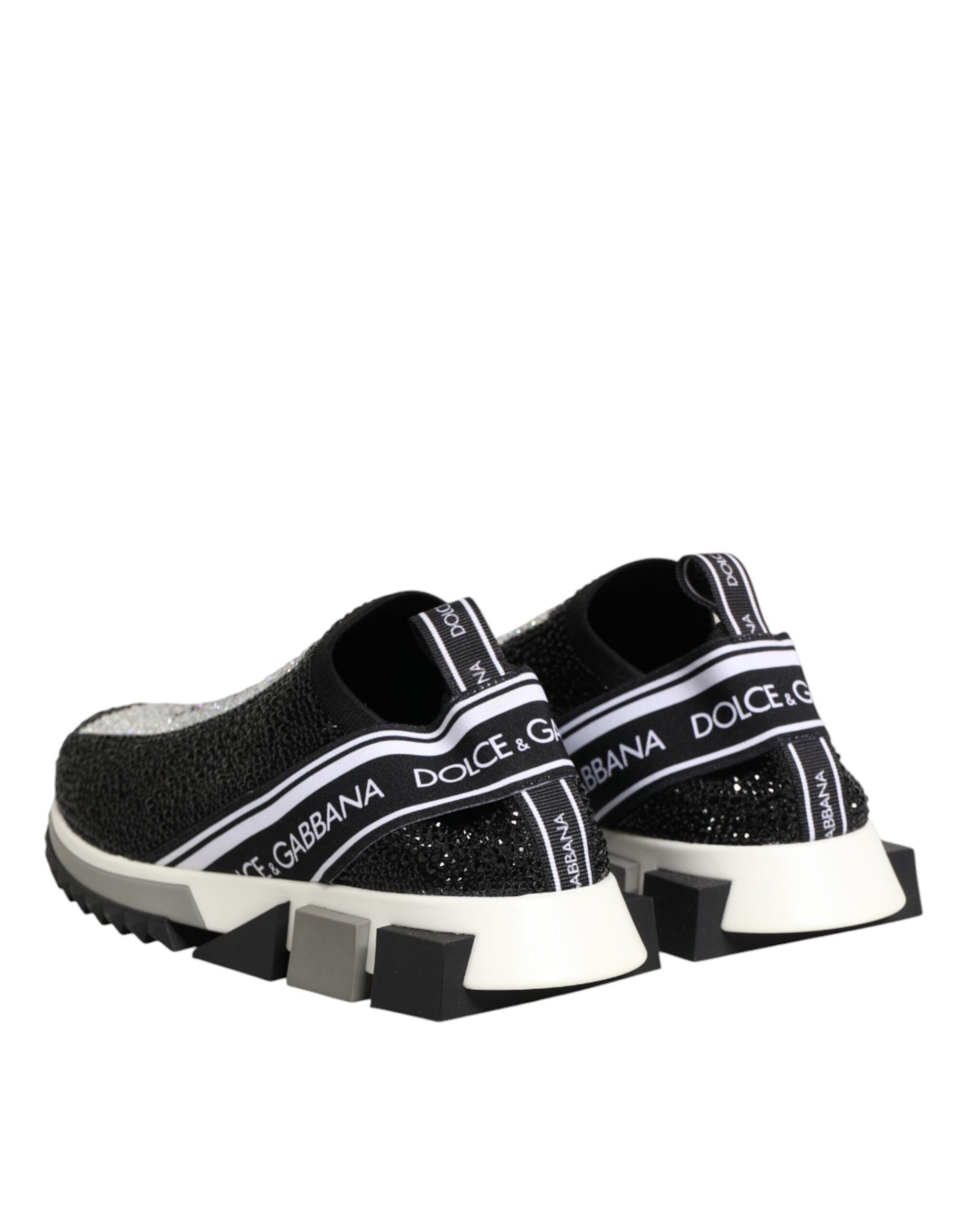 Black sneakers with white stripes and brand name on side