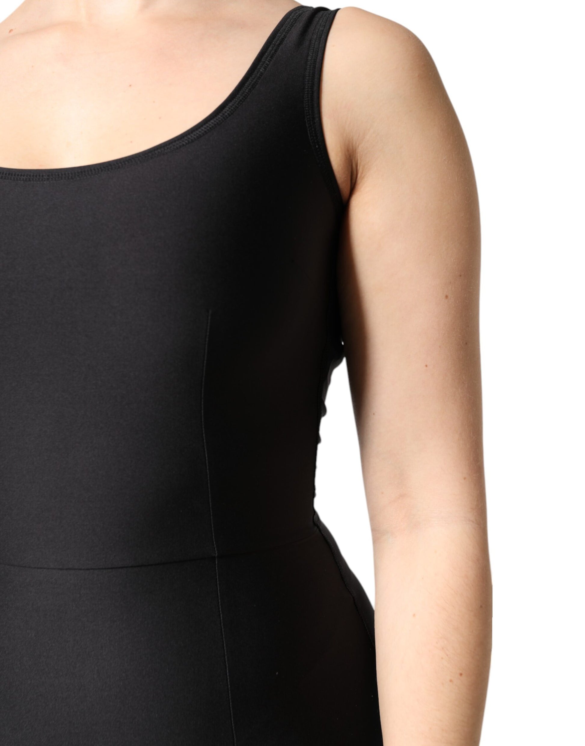 A black sleeveless bodycon jumpsuit dress on a mannequin