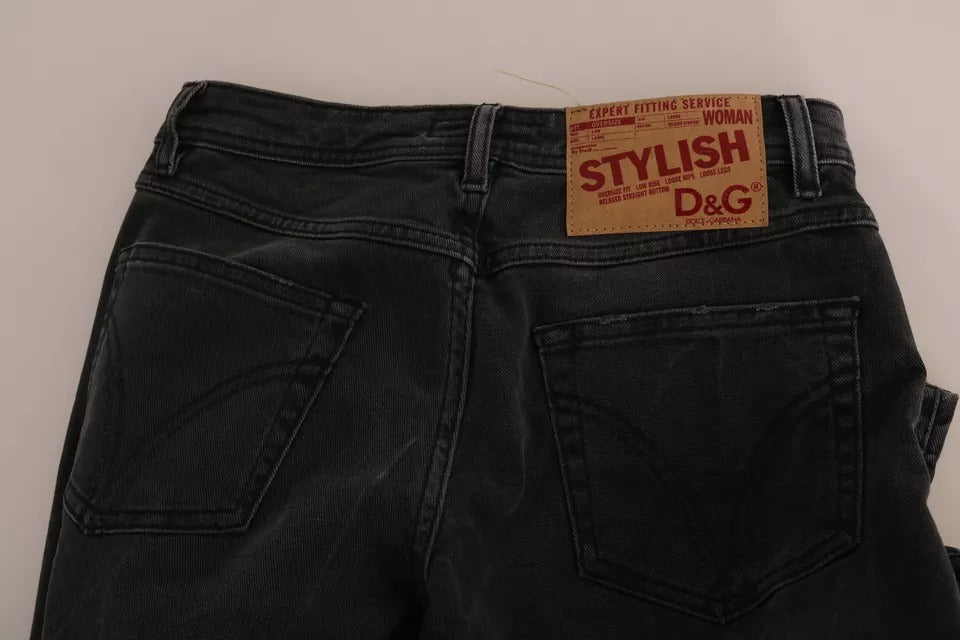 Pair of dark blue denim jeans with a tag on the waistband