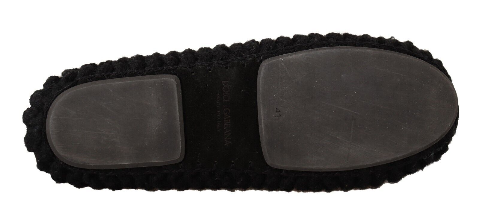 Pair of black shoes with a thick sole and laces