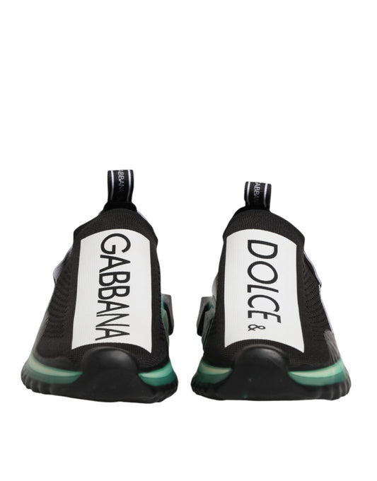 Pair of black sneakers with white text on side