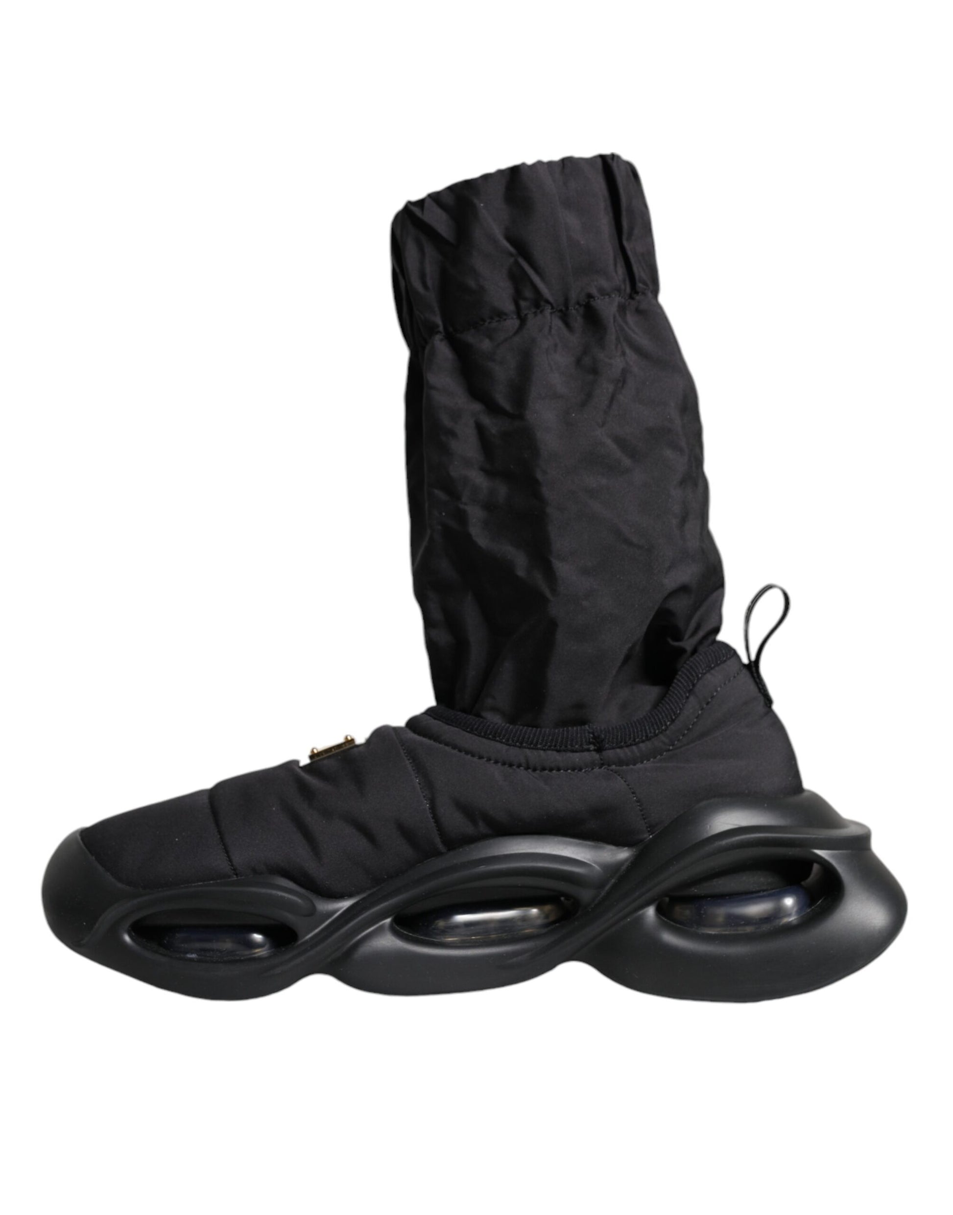 Pair of black roller shoes with wheels and a protective cover