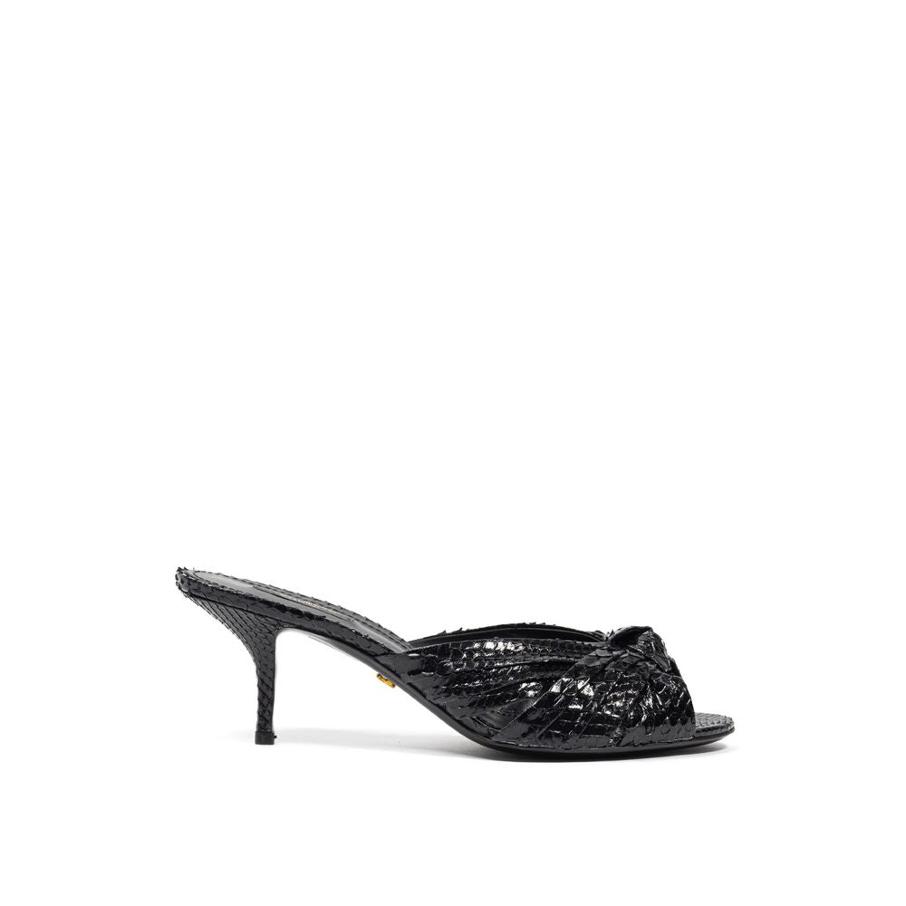 Black high heel shoe with embellishments on top