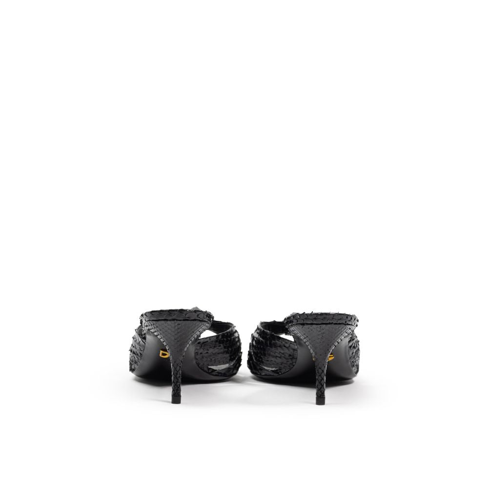 Pair of black high heel shoes with straps