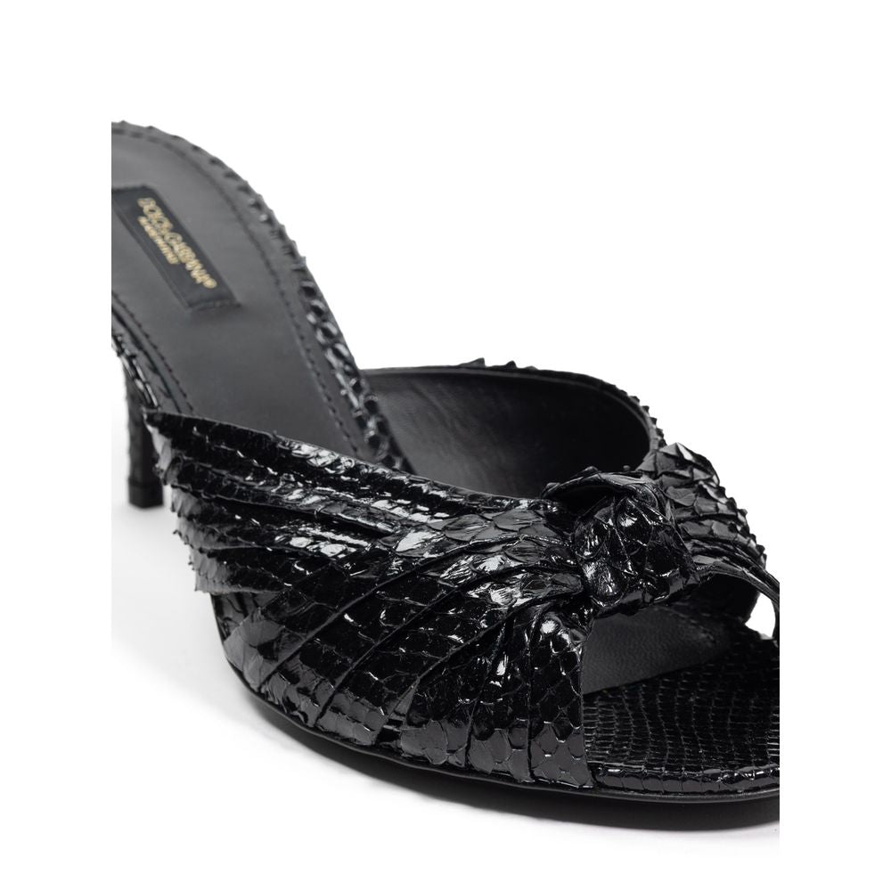 Black high heel shoe with ruffled design on toe