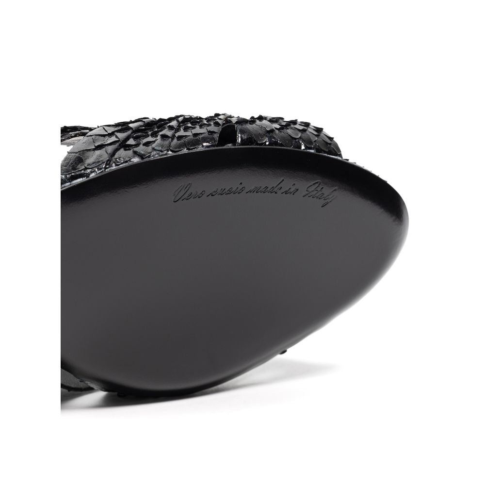 Black leather shoe with a crocodile skin texture on the toe cap