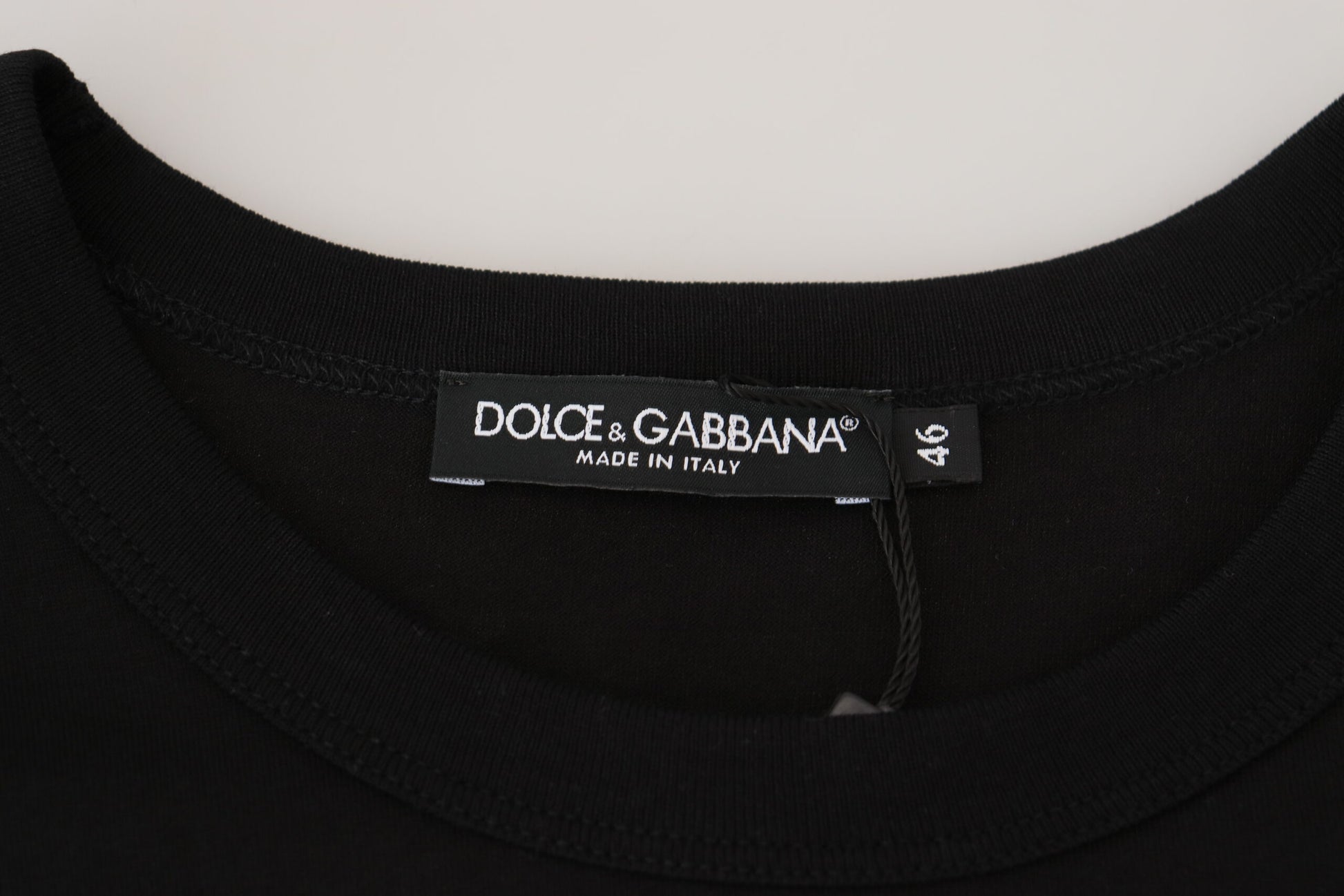 Black t-shirt with a brand label on the neckline
