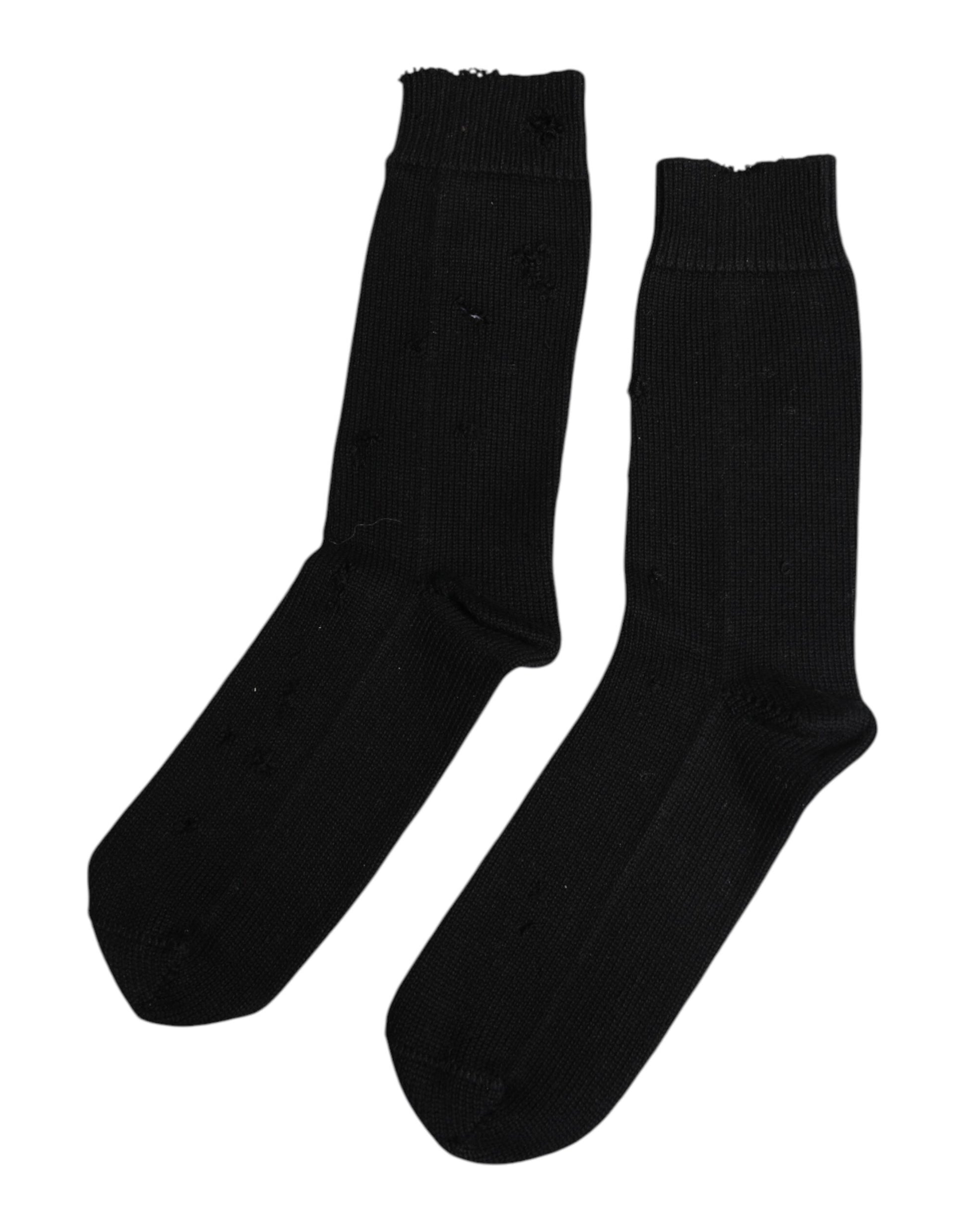 Two black socks with white stripes on top
