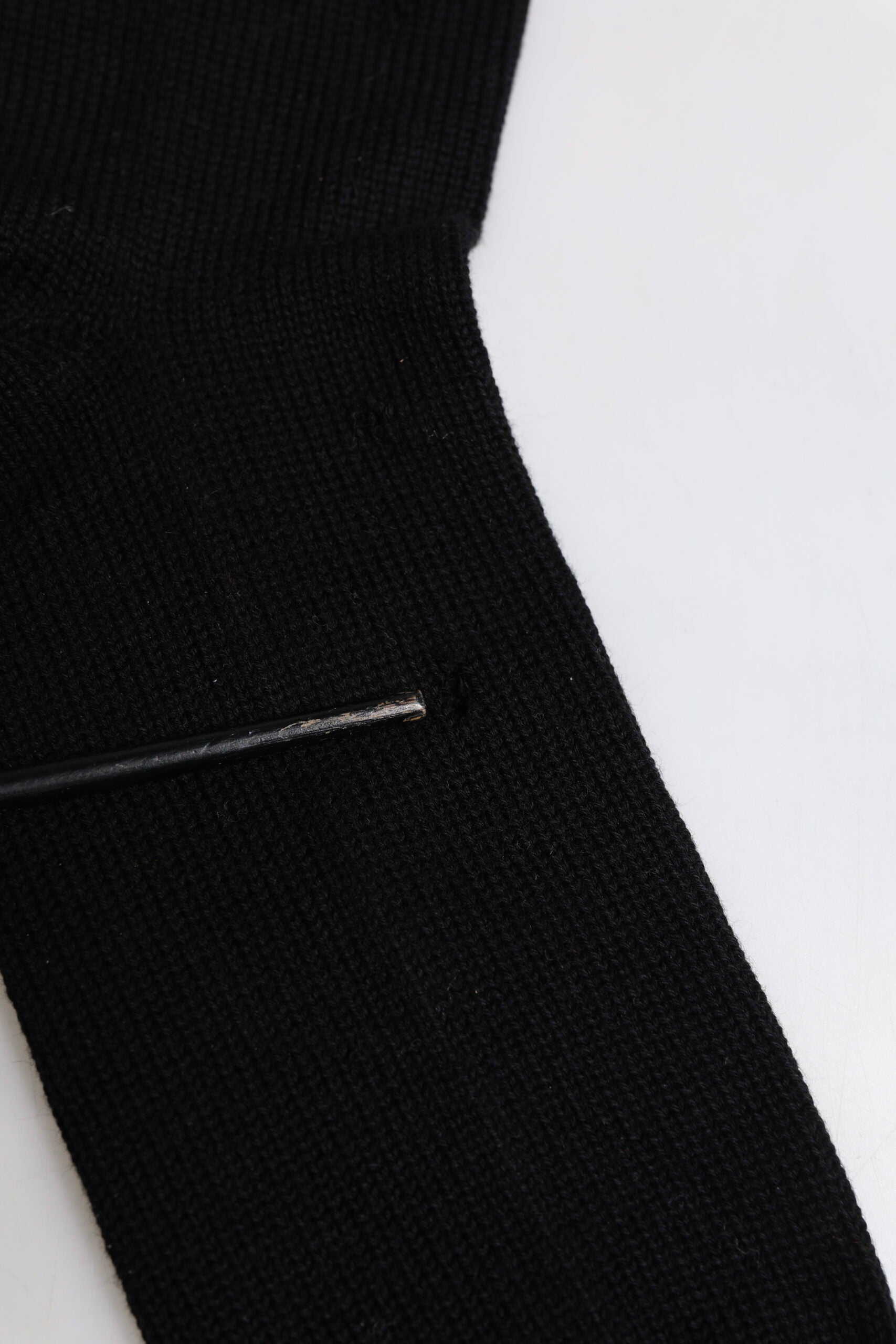 Black fabric with white stitching