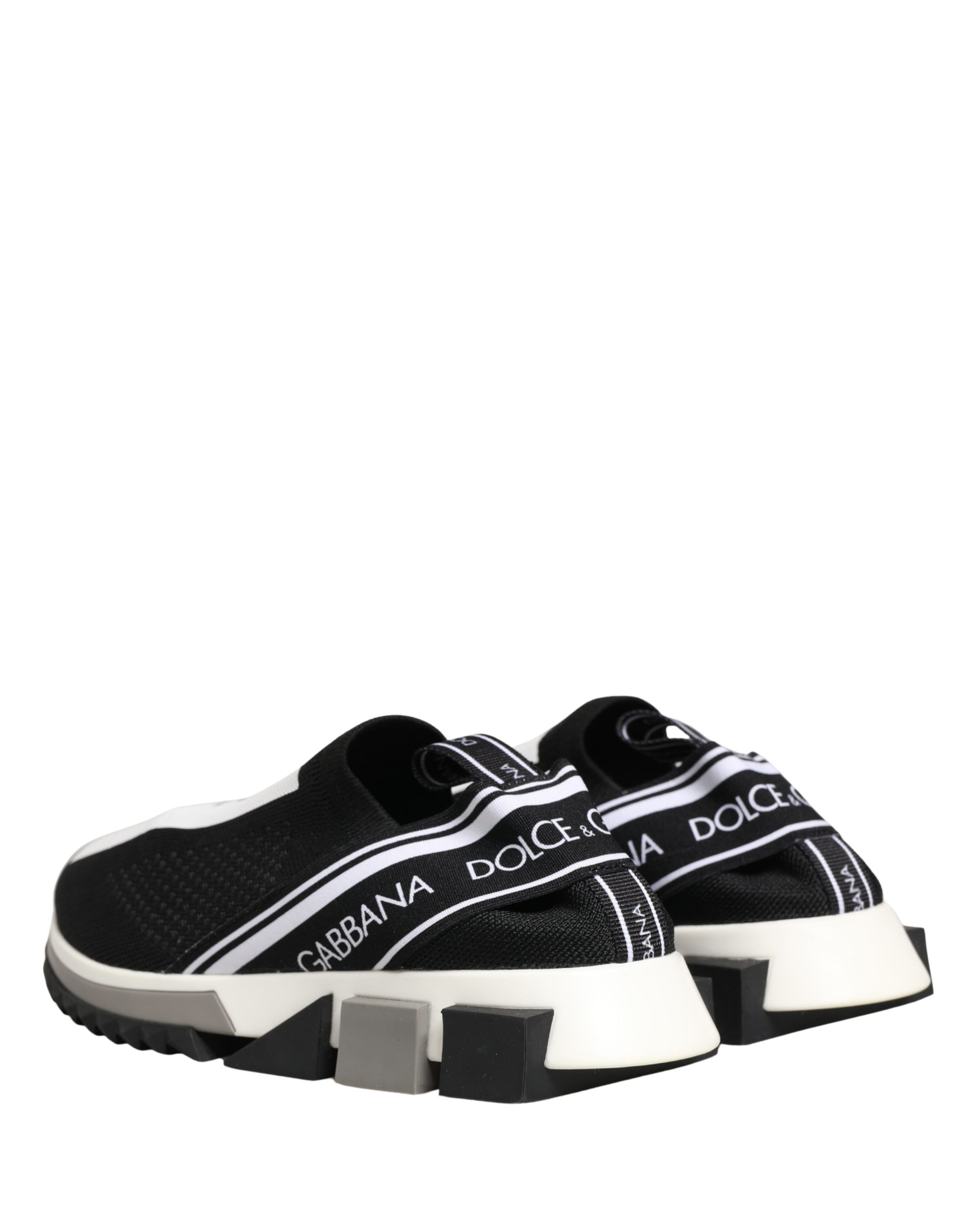 Pair of black slip-on shoes with white soles and white laces