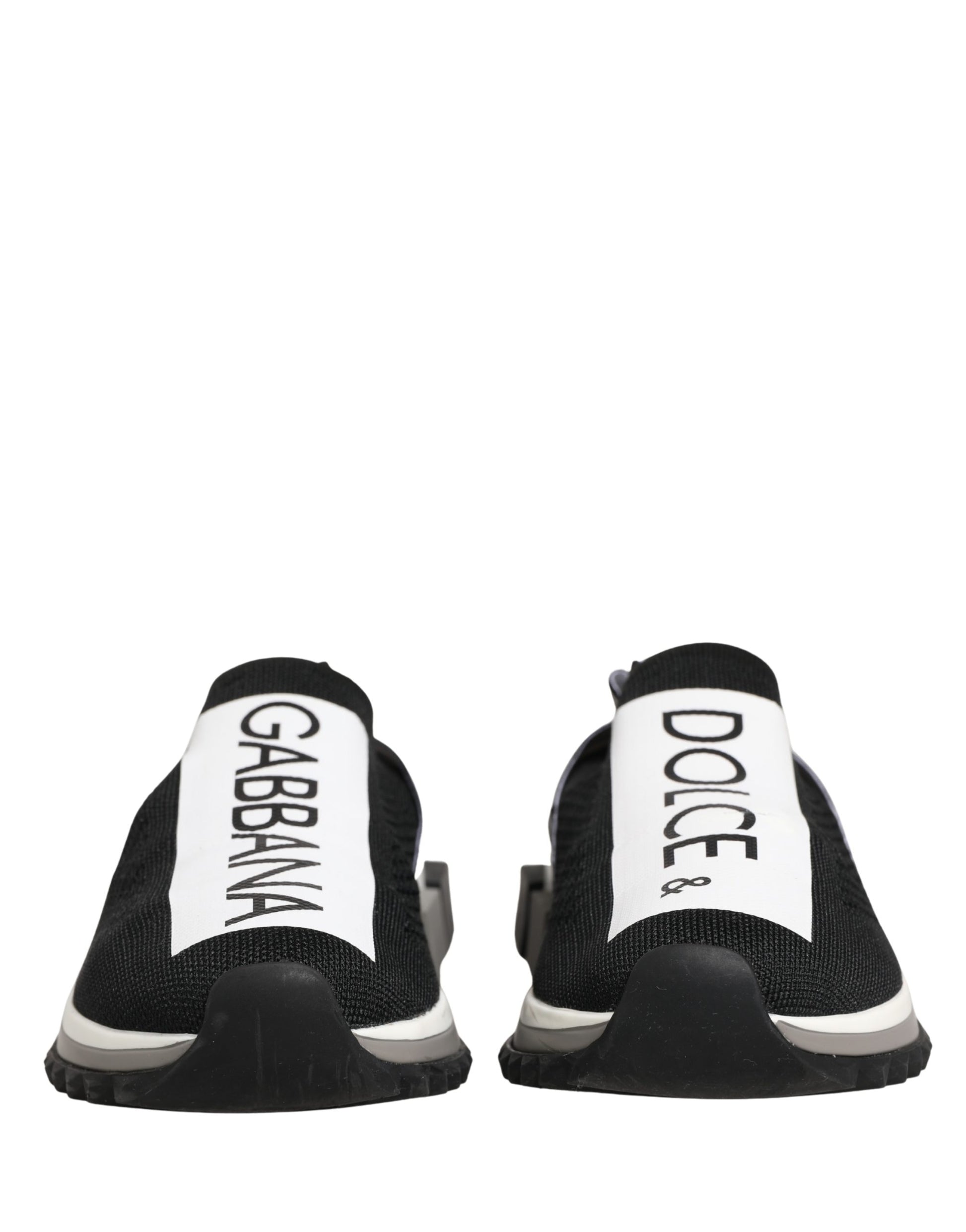 Pair of black slip-on shoes with white text and logo on side