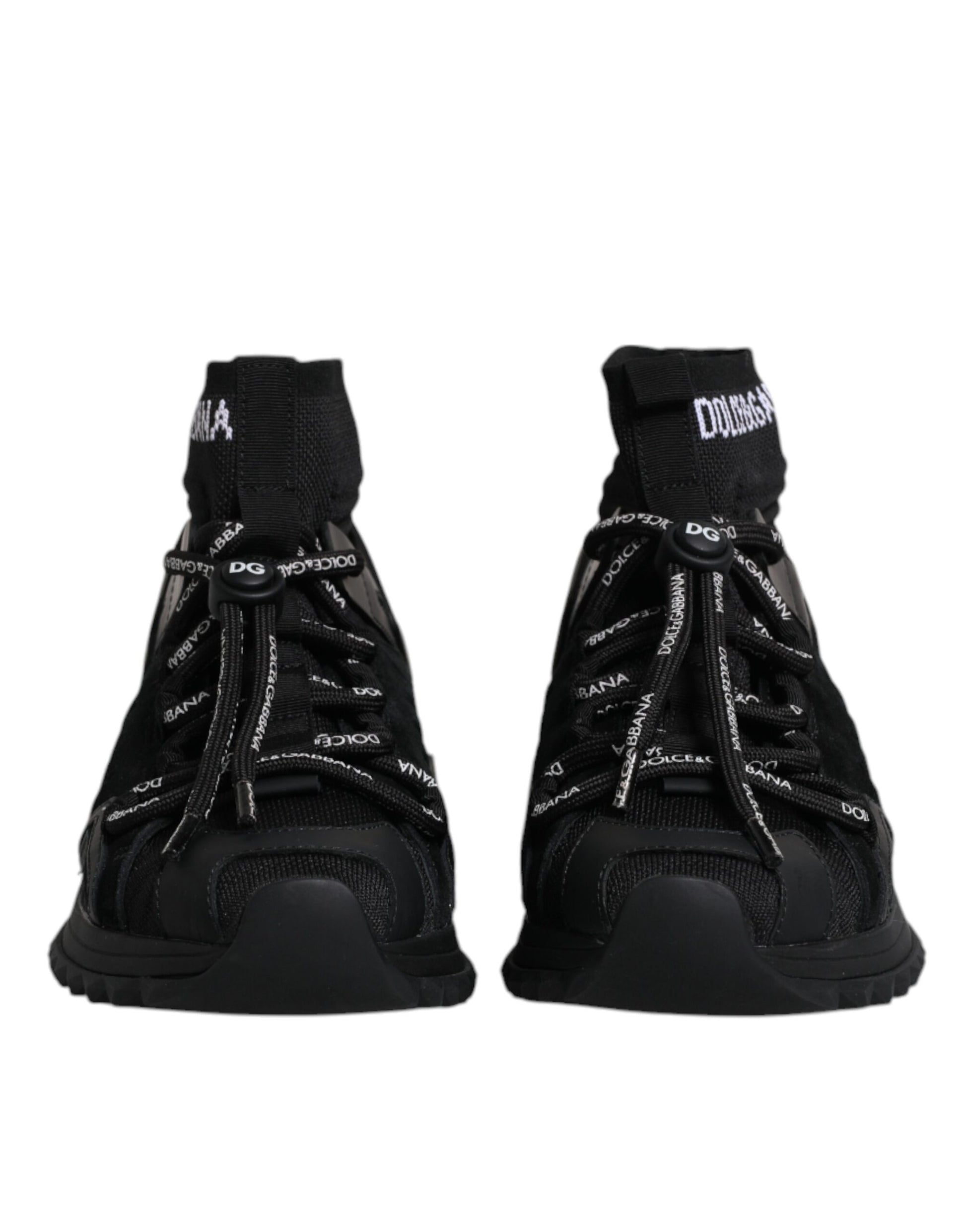 Pair of black sneakers with white laces and brand name on side