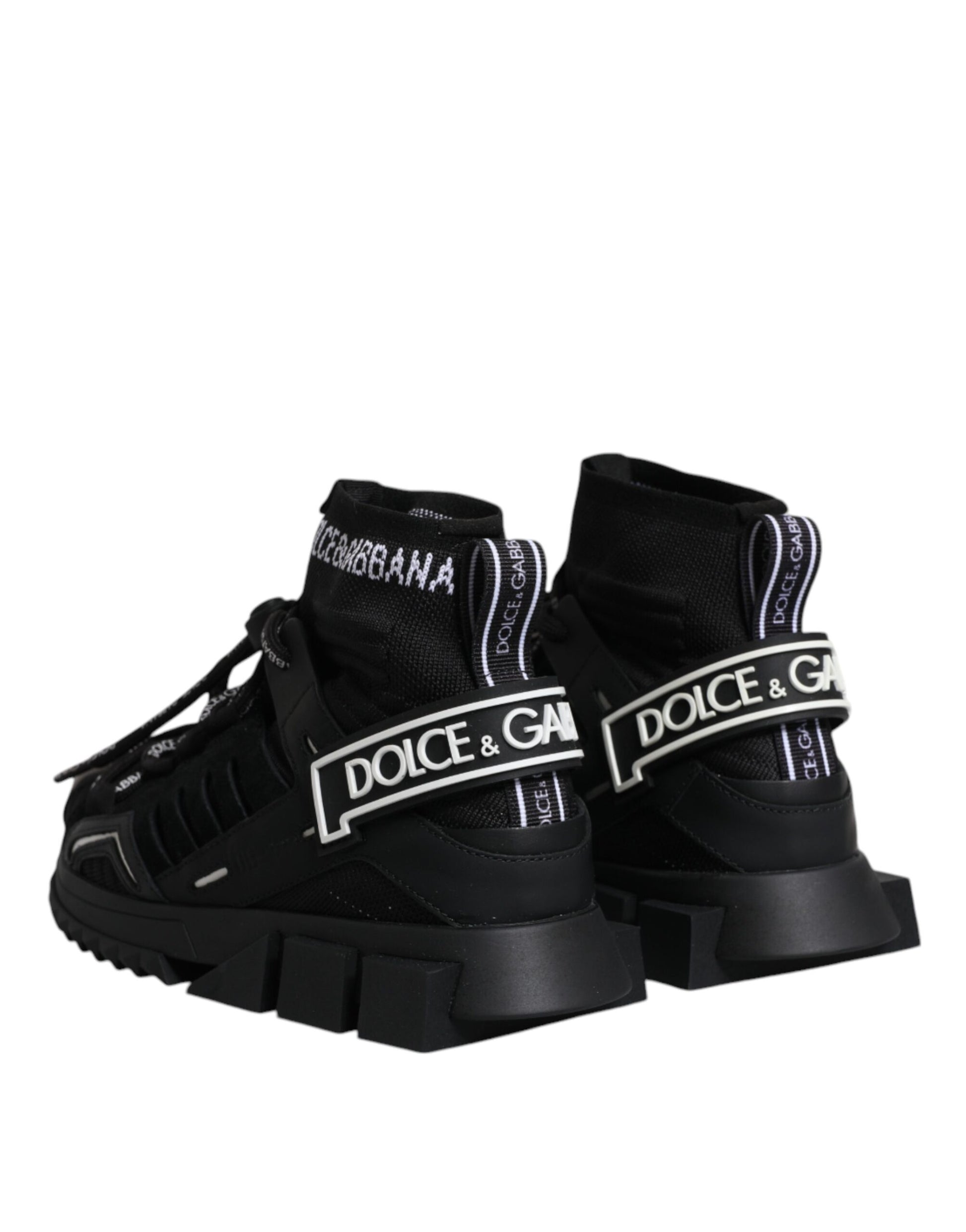 Pair of black sneakers with white and pink branding
