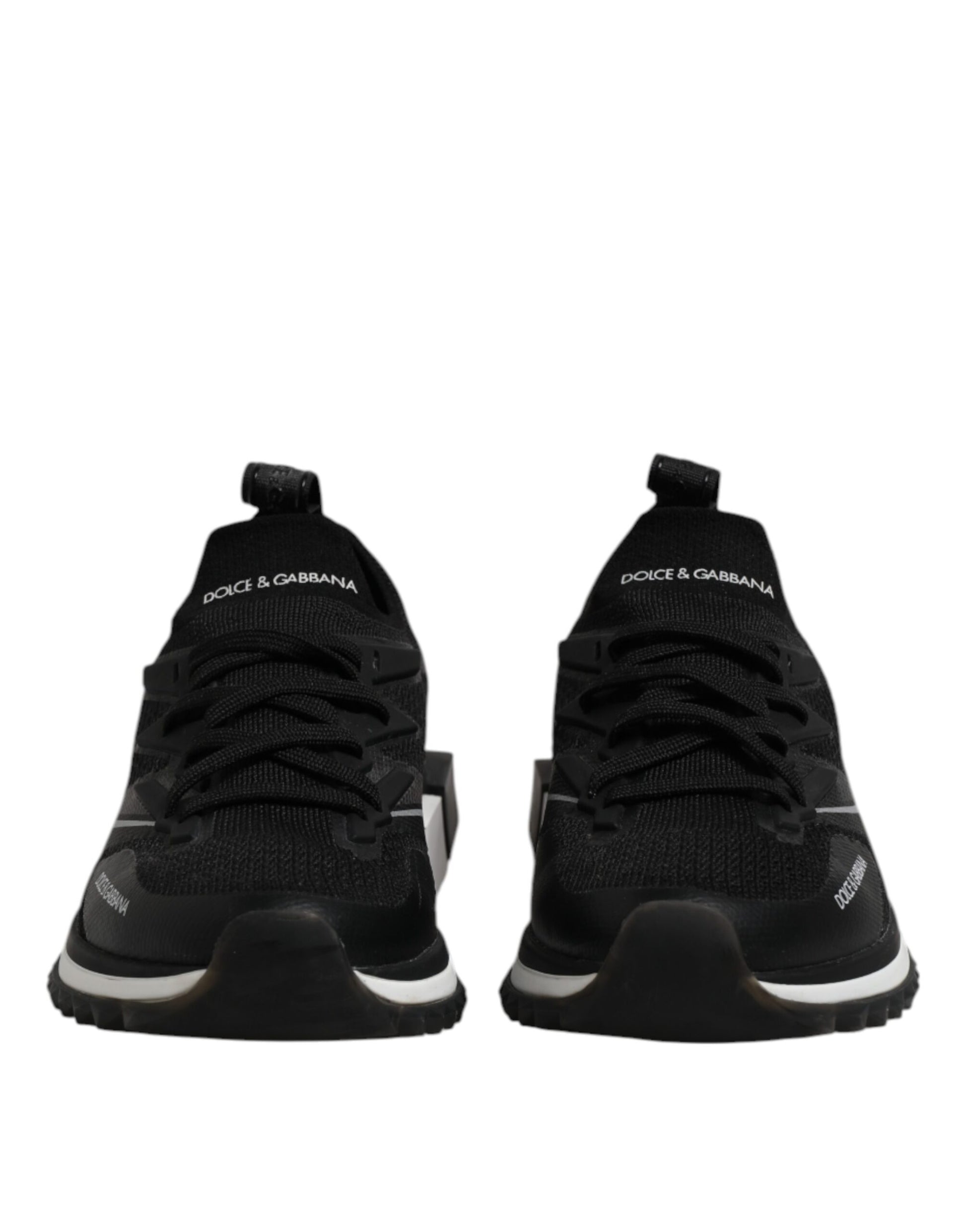Pair of black sneakers with white soles