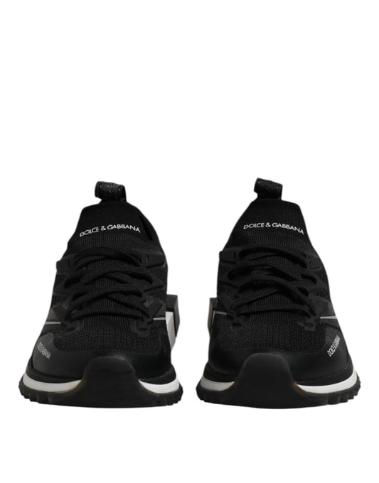 Pair of black sneakers with white soles
