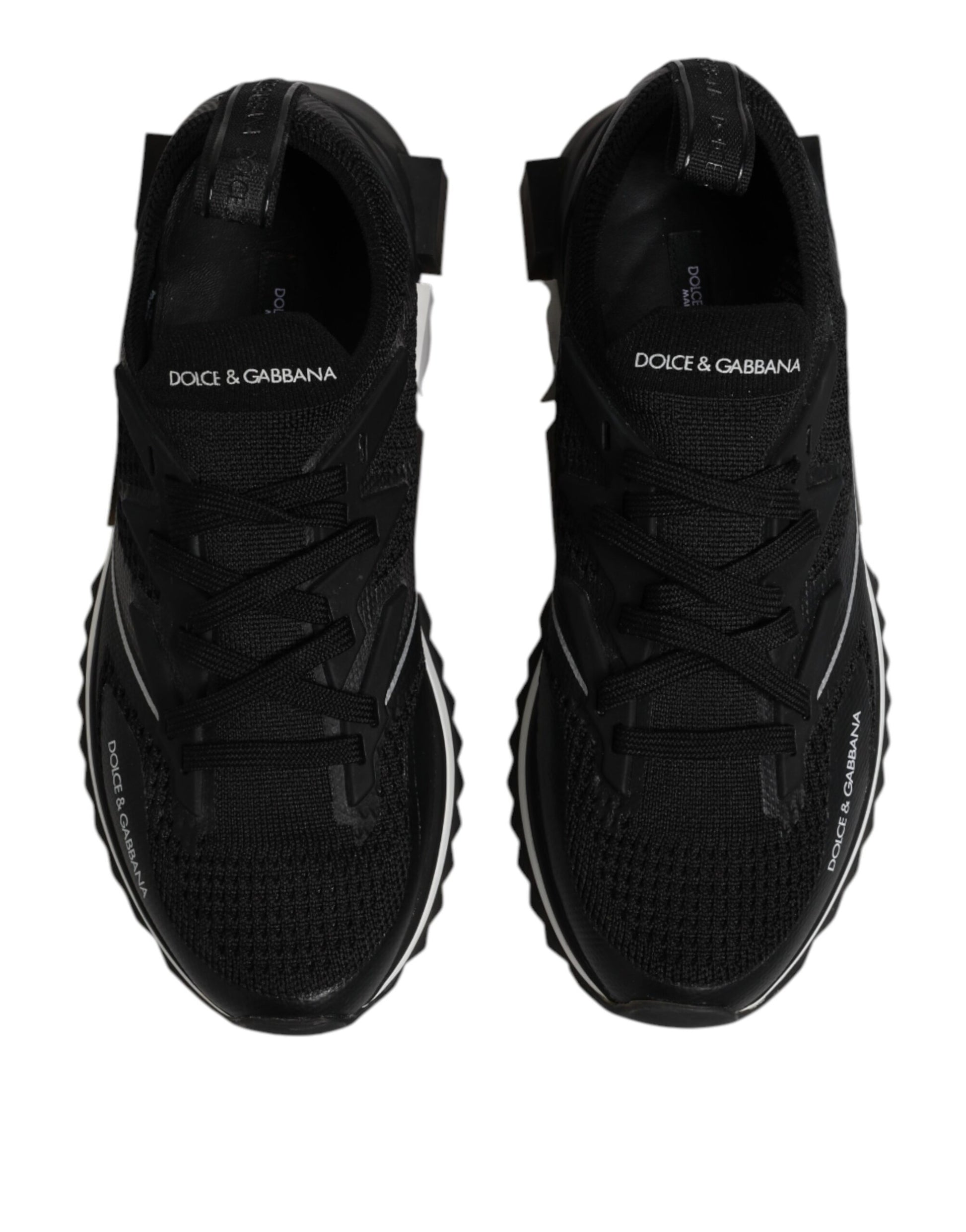 Pair of black athletic shoes with white logo on side