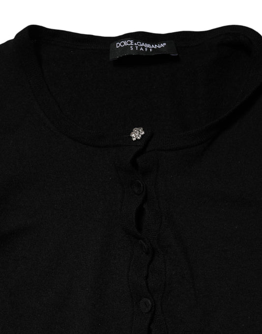 Black sweater with ribbed neckline and cuffs