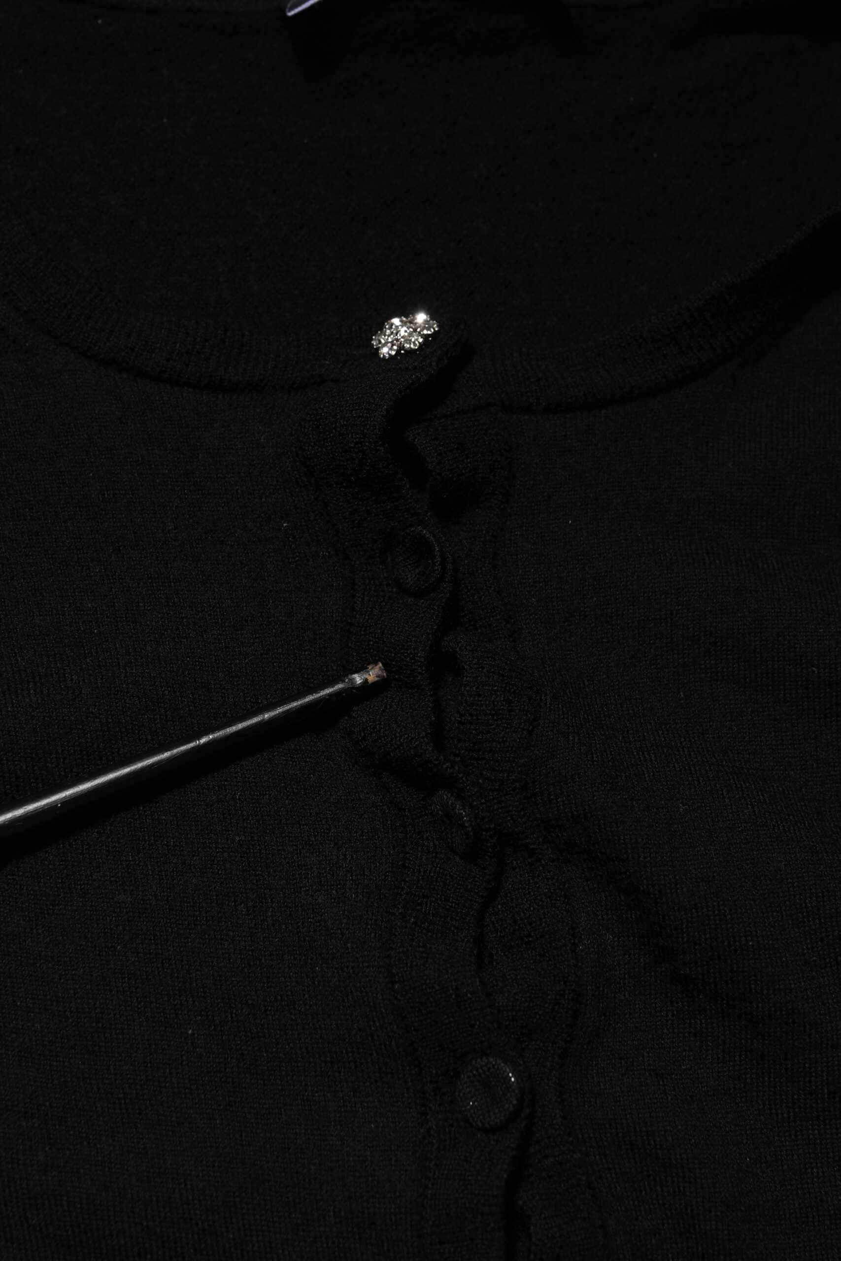 Black sweater with button closure