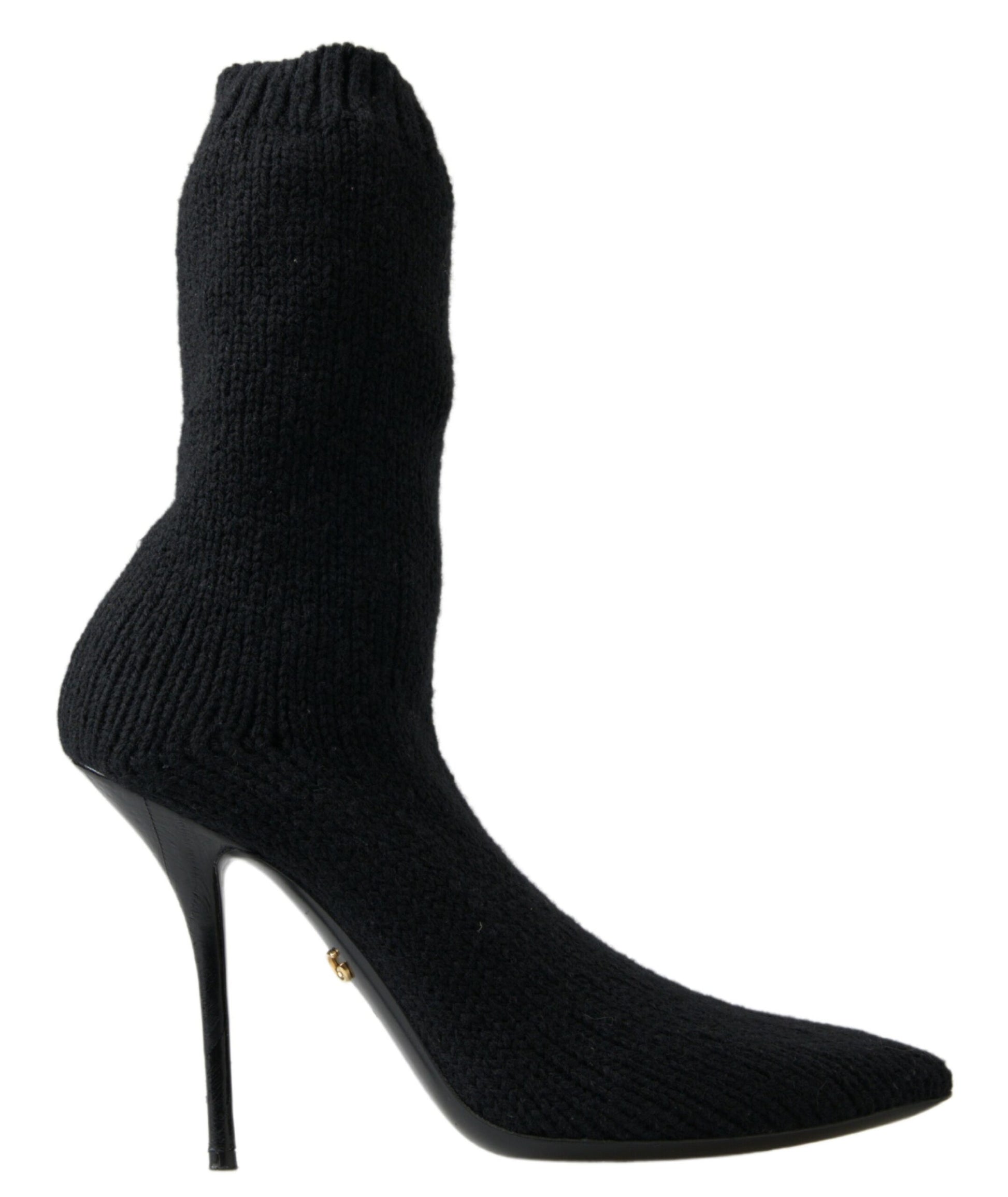 Black knee high boot with a pointed toe and a heel
