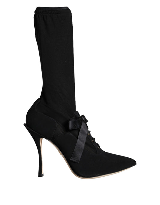 Black knee high boots with bow detailing