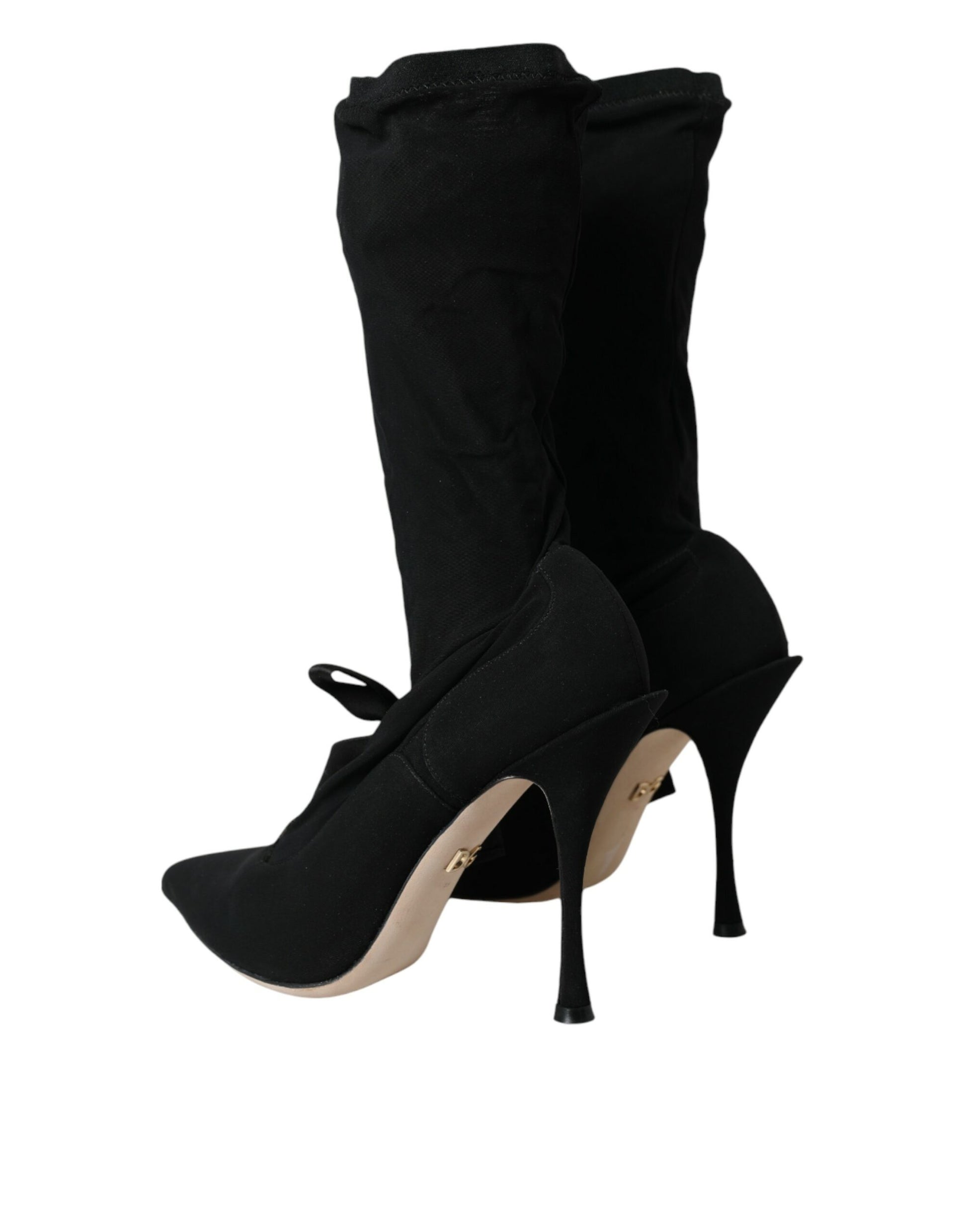 Pair of black high heel shoes with straps and buckles