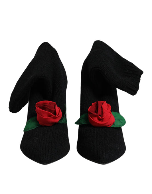 Pair of black gloves with red roses on wrists