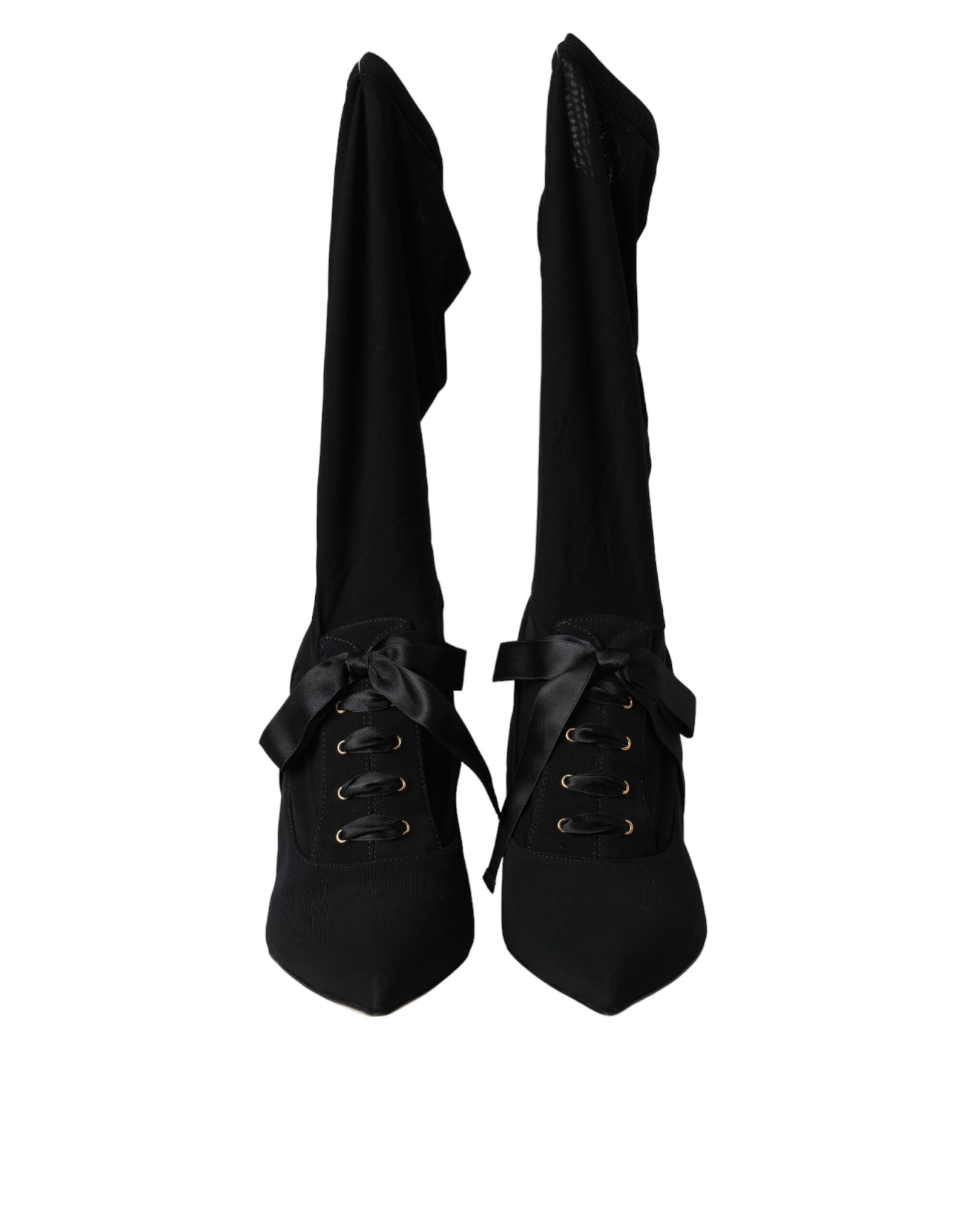 Pair of black knee high boots with laces and buckles