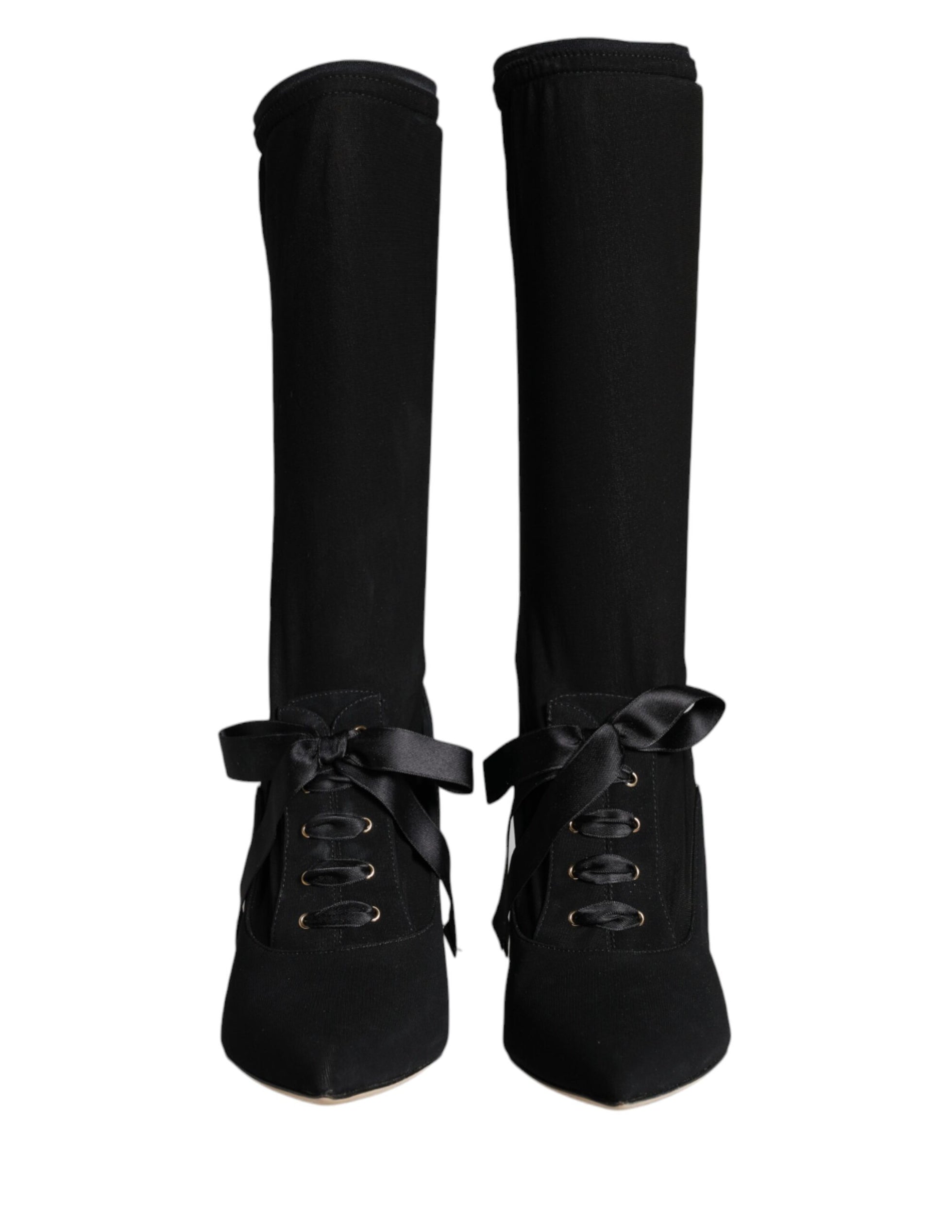 Pair of black knee high boots with laces