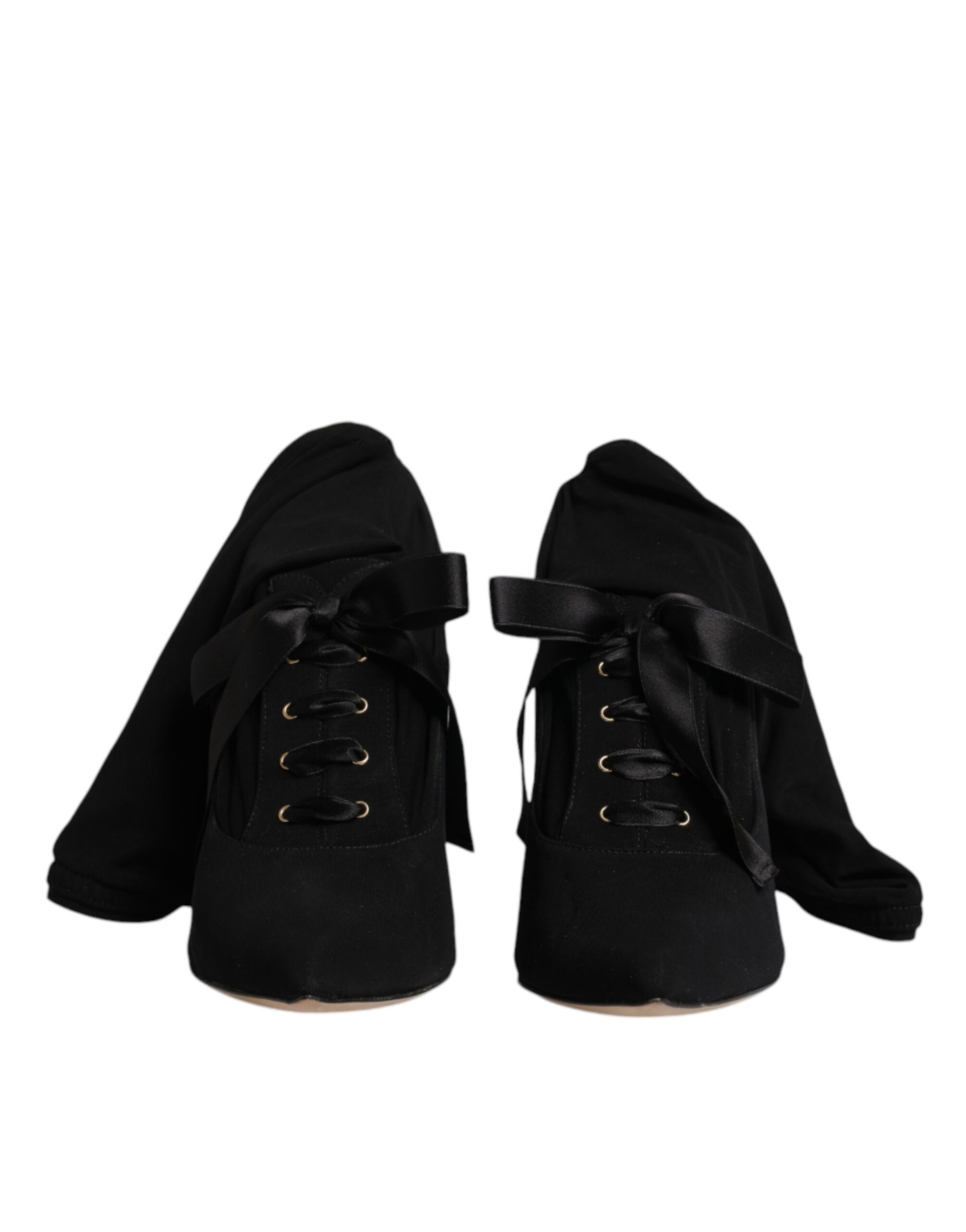 Pair of black boots with laces and buckles