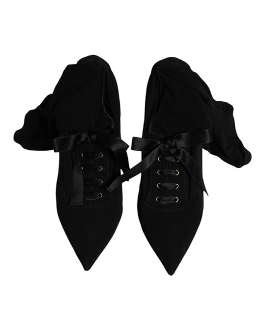 Pair of black boots with laces and buckles