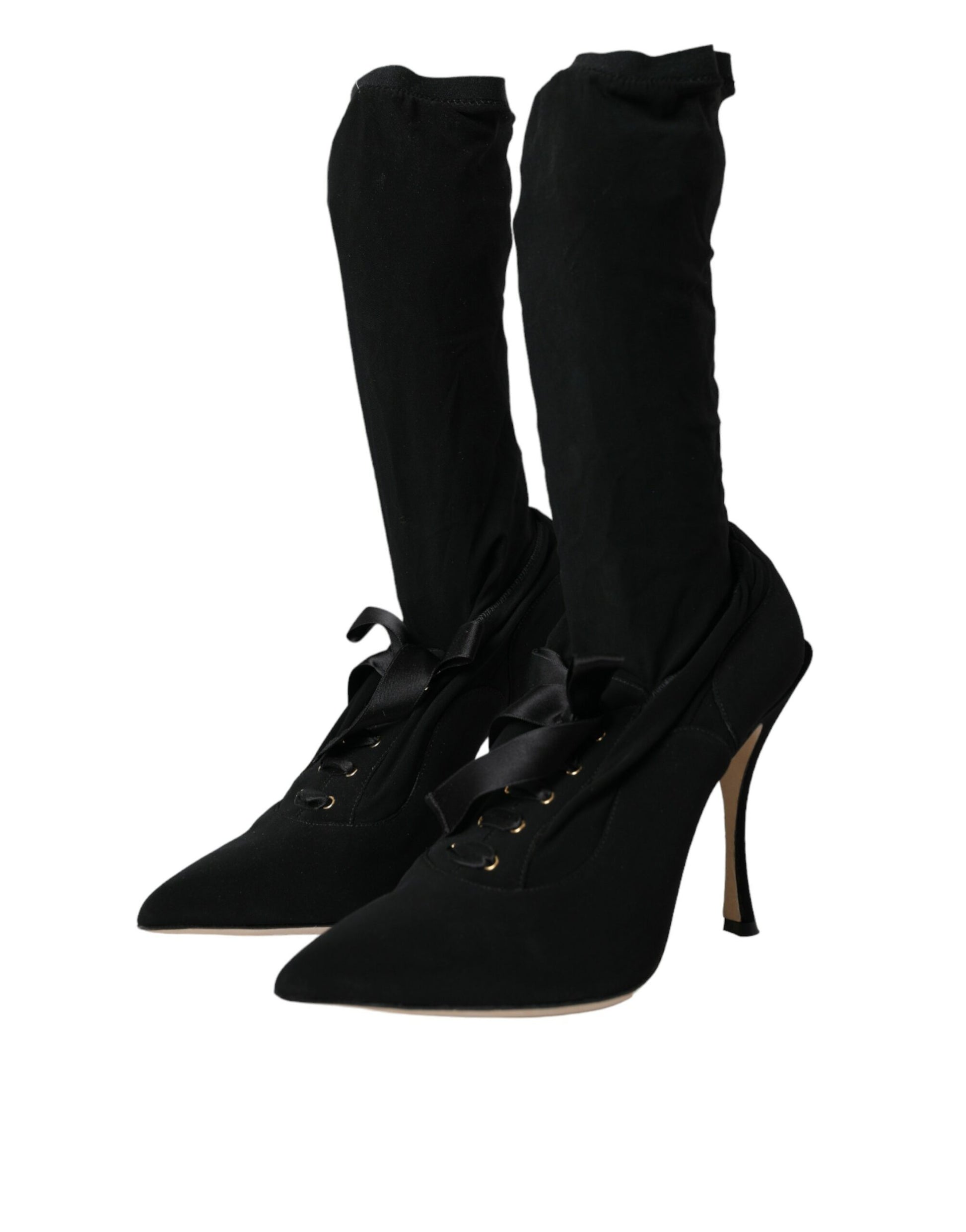 Pair of black knee high boots with laces and heels