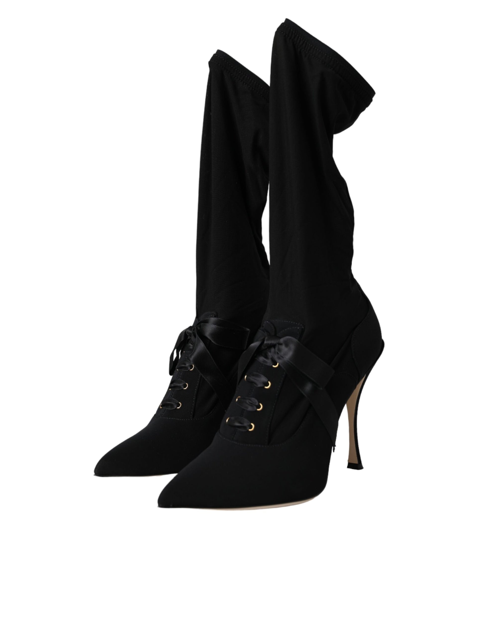 Pair of black knee high boots with heels